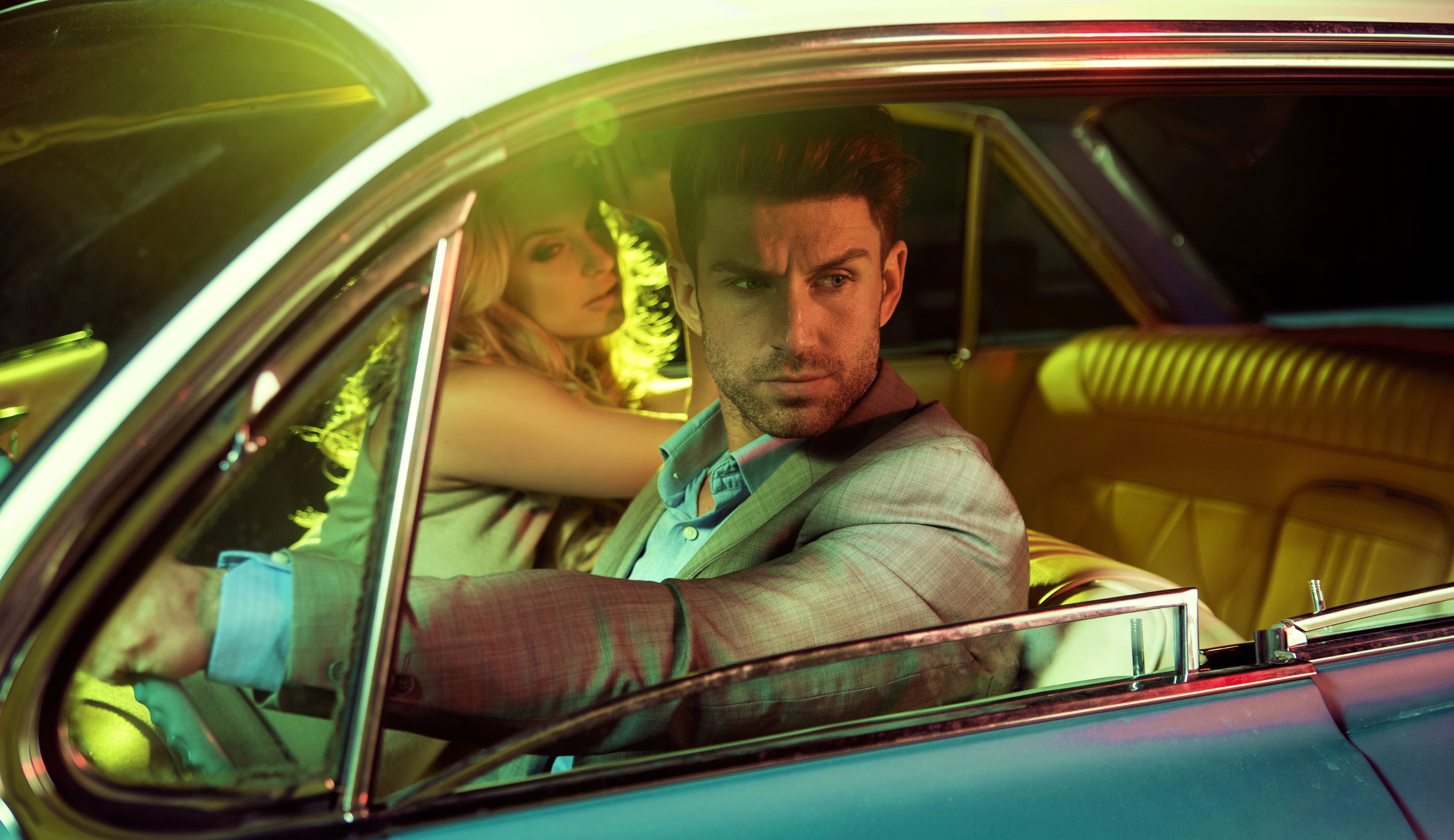 Man and Blonde Woman in Vintage Car HD Wallpaper