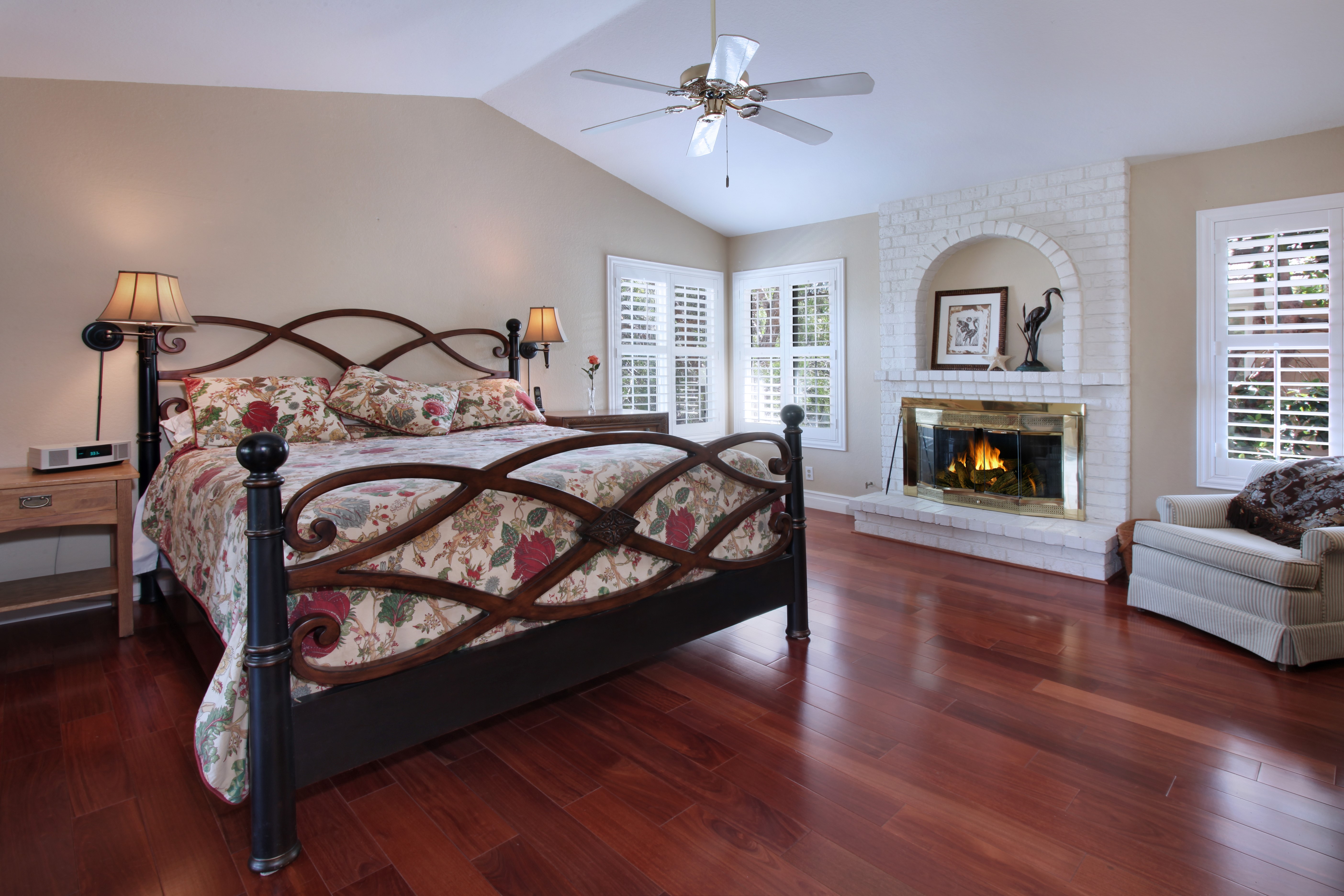 Bedroom with Fireplace and Bed HD Wallpaper