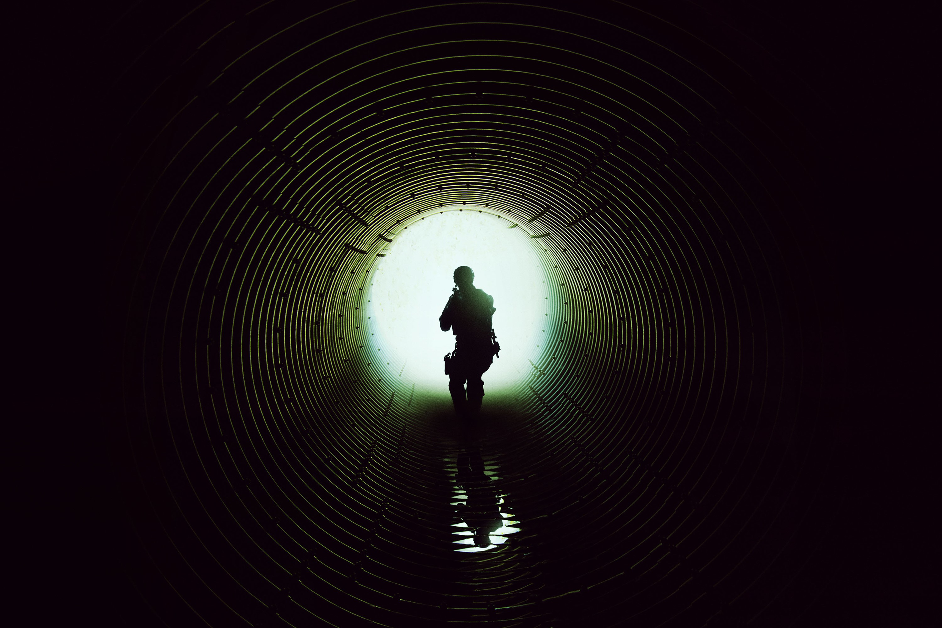Soldier in a dark tunnel HD Wallpaper