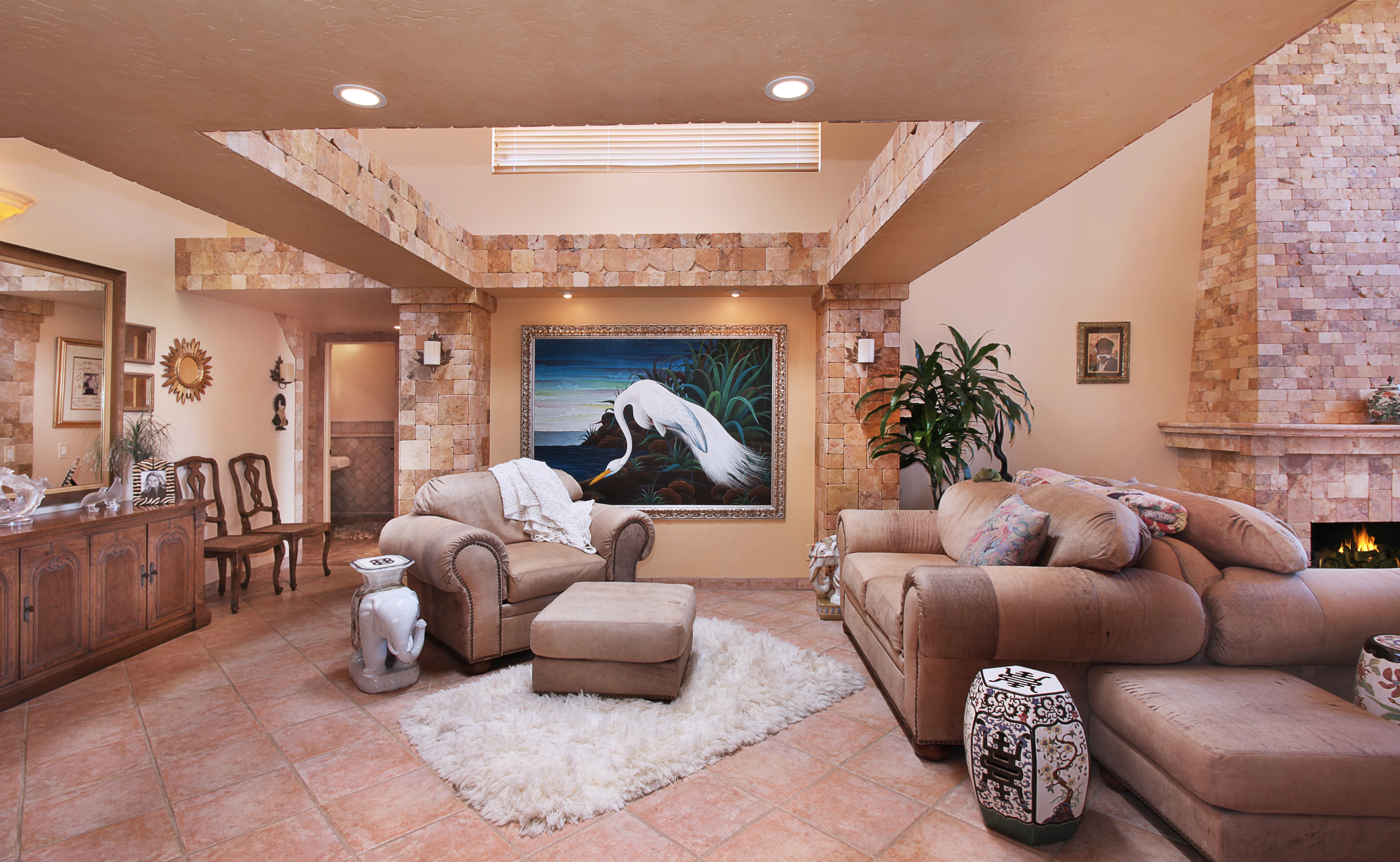 Living room with sofa, armchair, and pictorial art HD Wallpaper