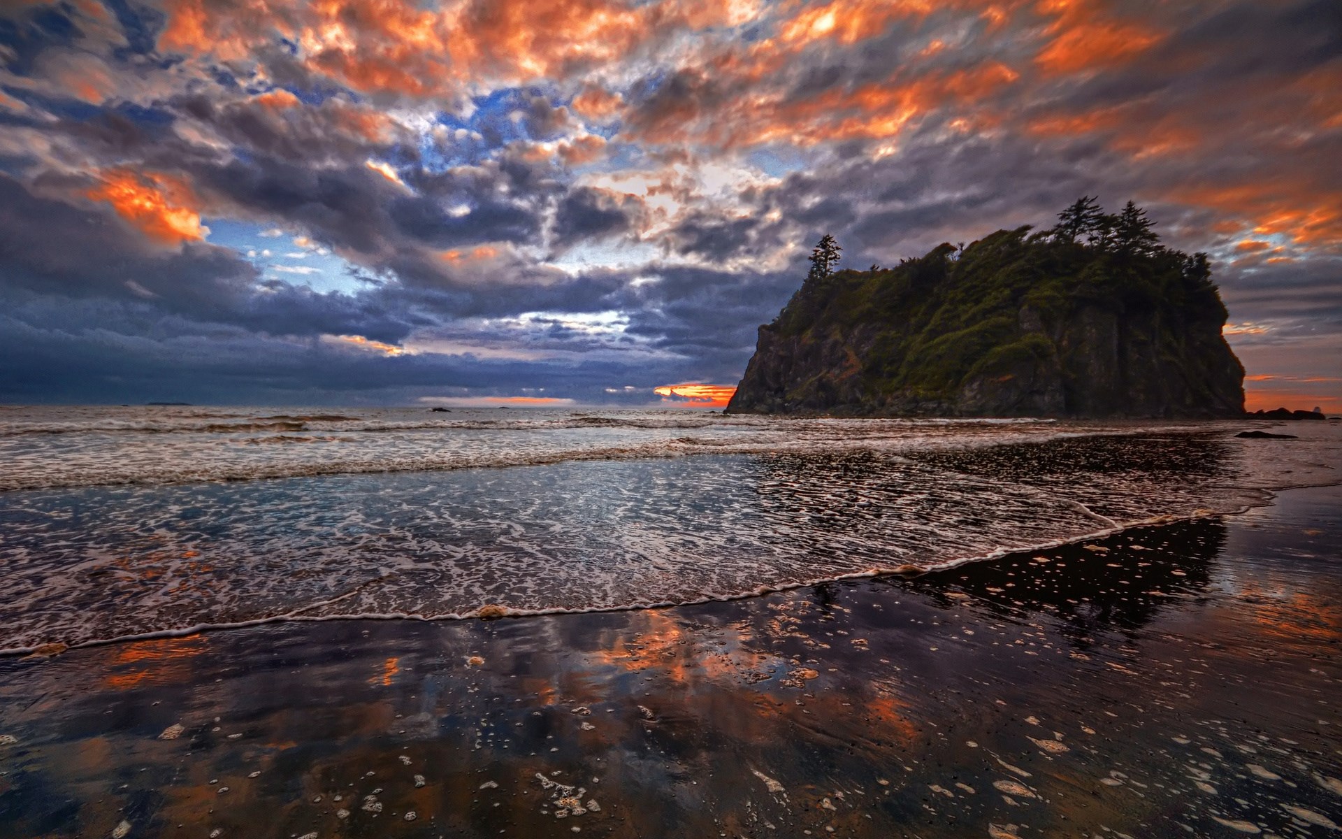 Dramatic sunset over a rocky island and the ocean HD Wallpaper