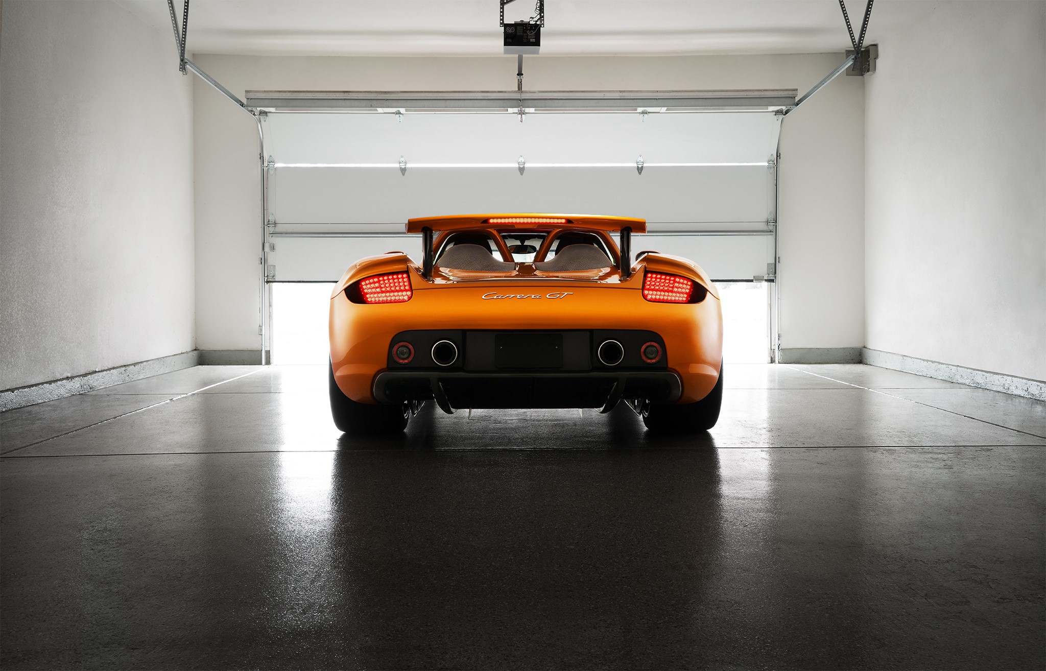 Porsche Carrera GT Arancio Borealis Supercar in Garage HD Wallpaper
