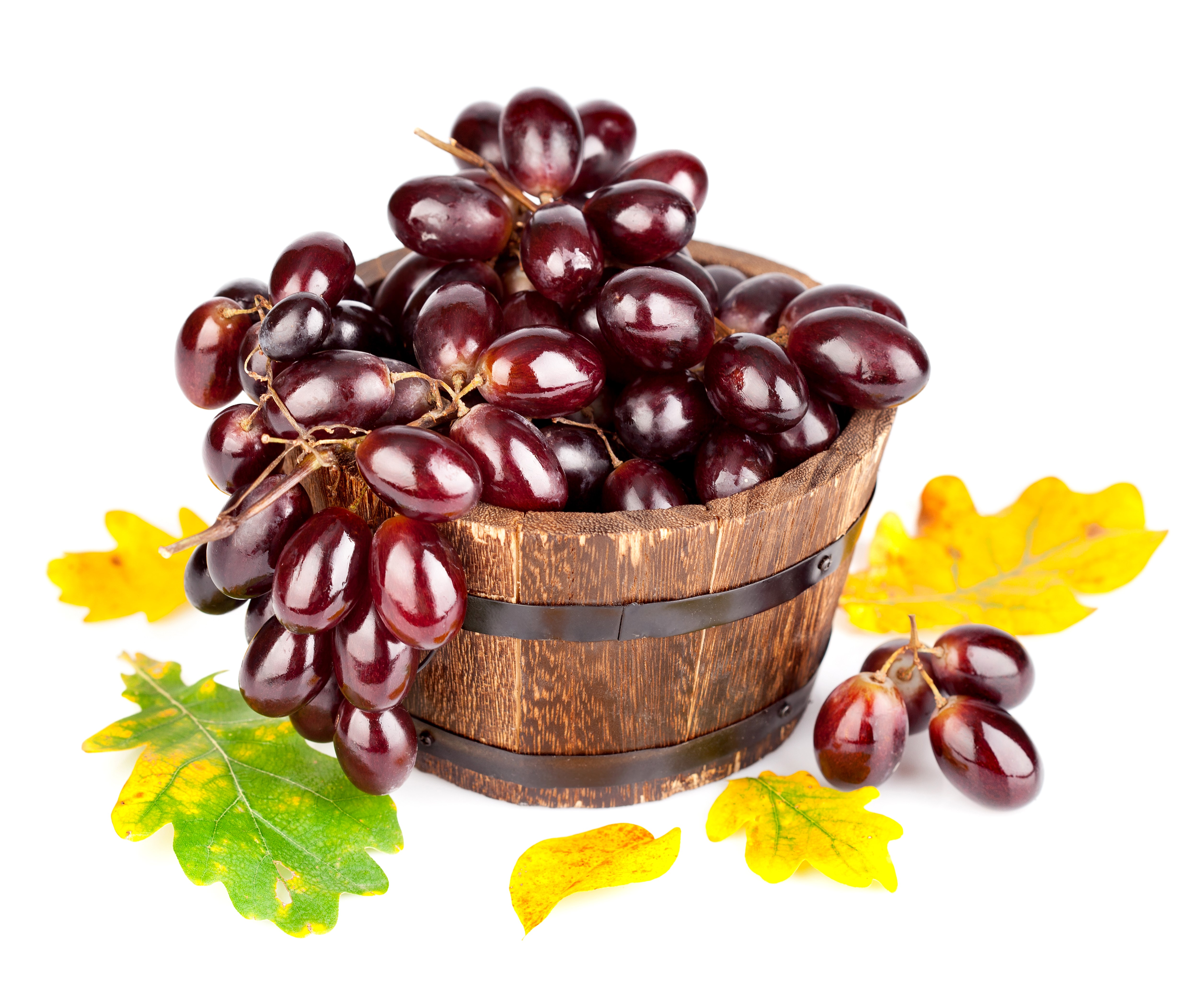 Grapes in a wooden bucket with autumn leaves HD Wallpaper