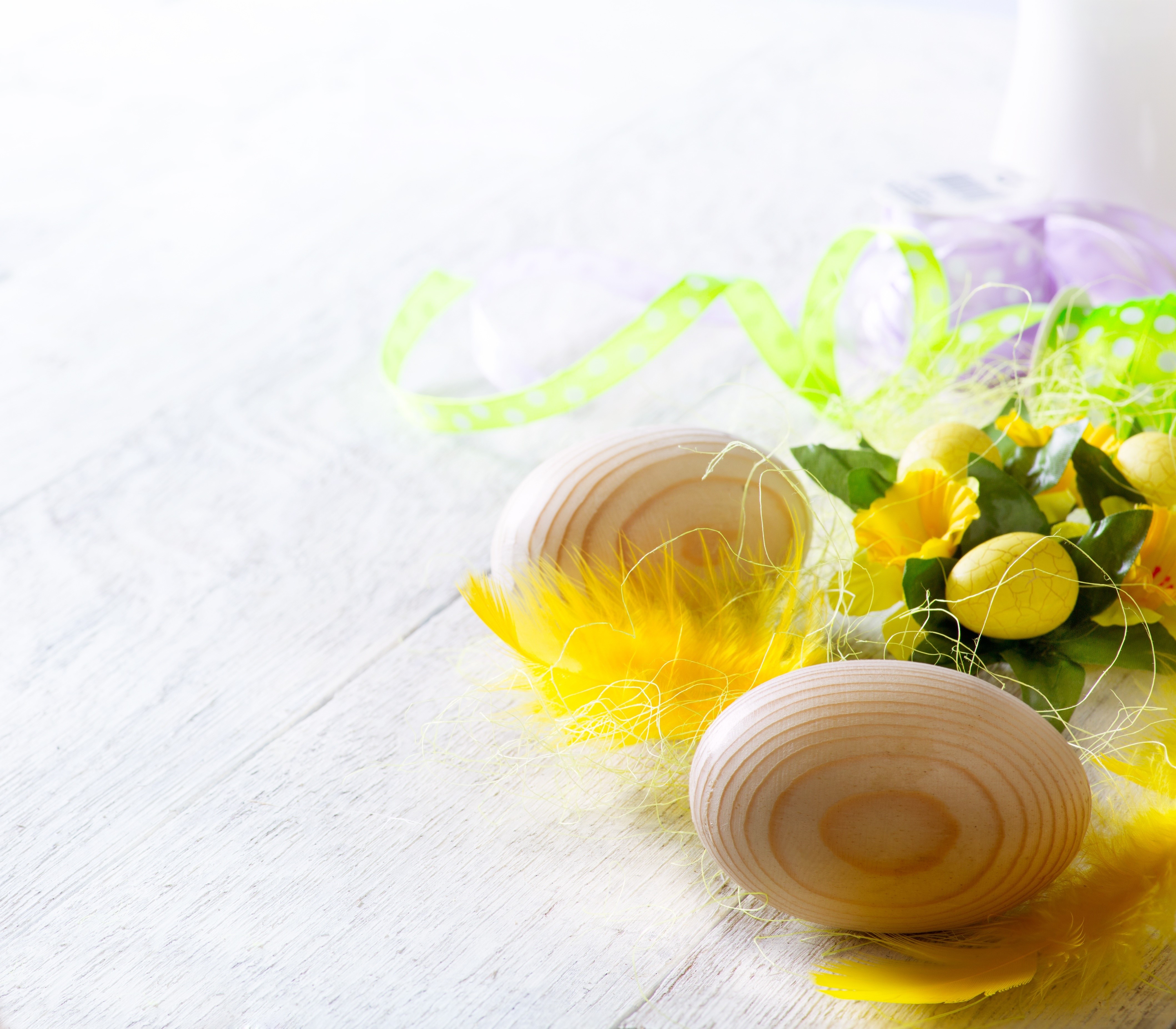 Easter eggs with yellow feathers and flowers HD Wallpaper