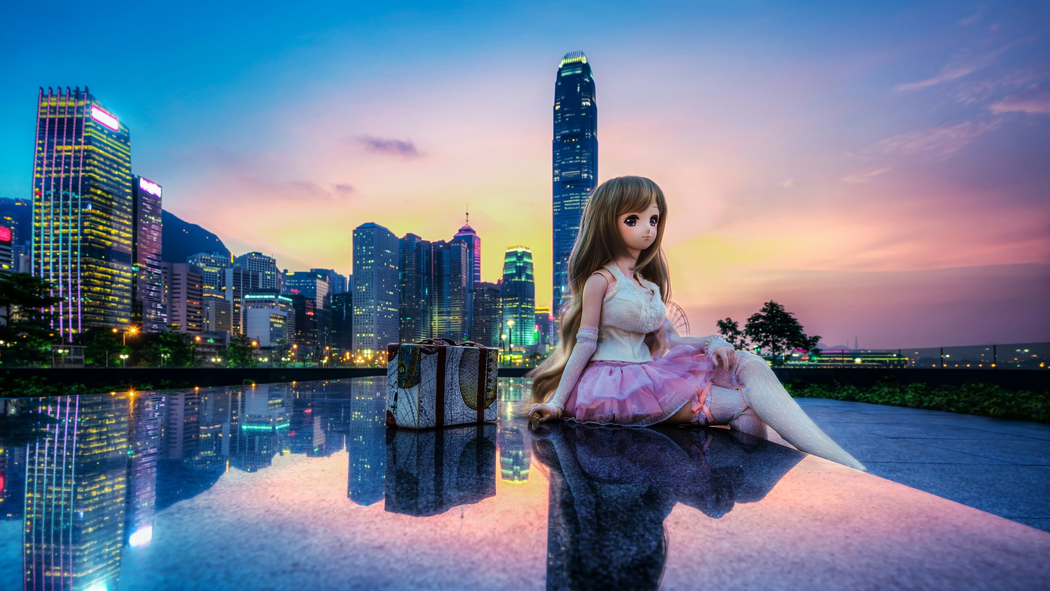 Doll in Hong Kong with Skyscrapers at Sunset HD Wallpaper