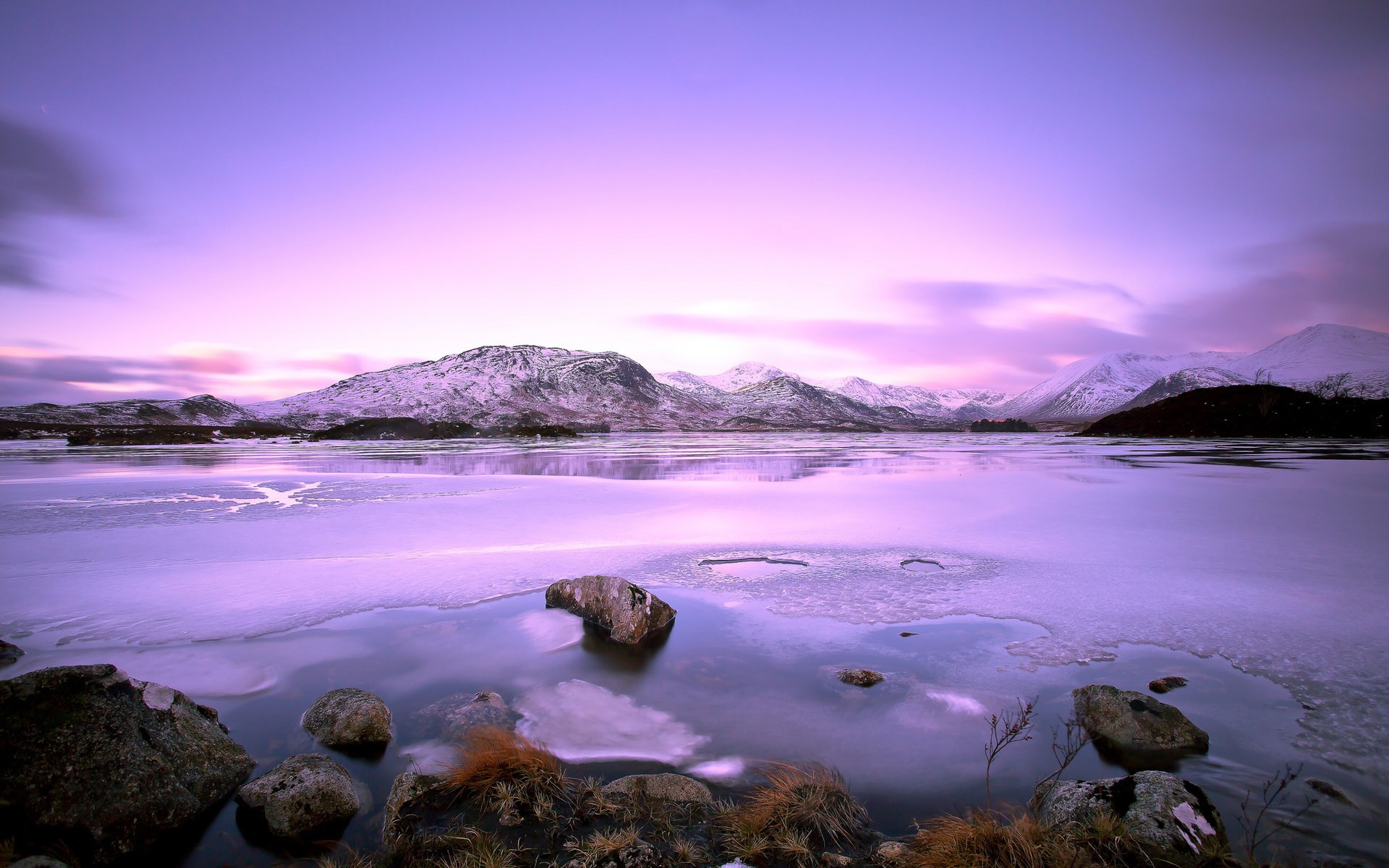 Frozen lake and snow-capped mountains at twilight HD Wallpaper