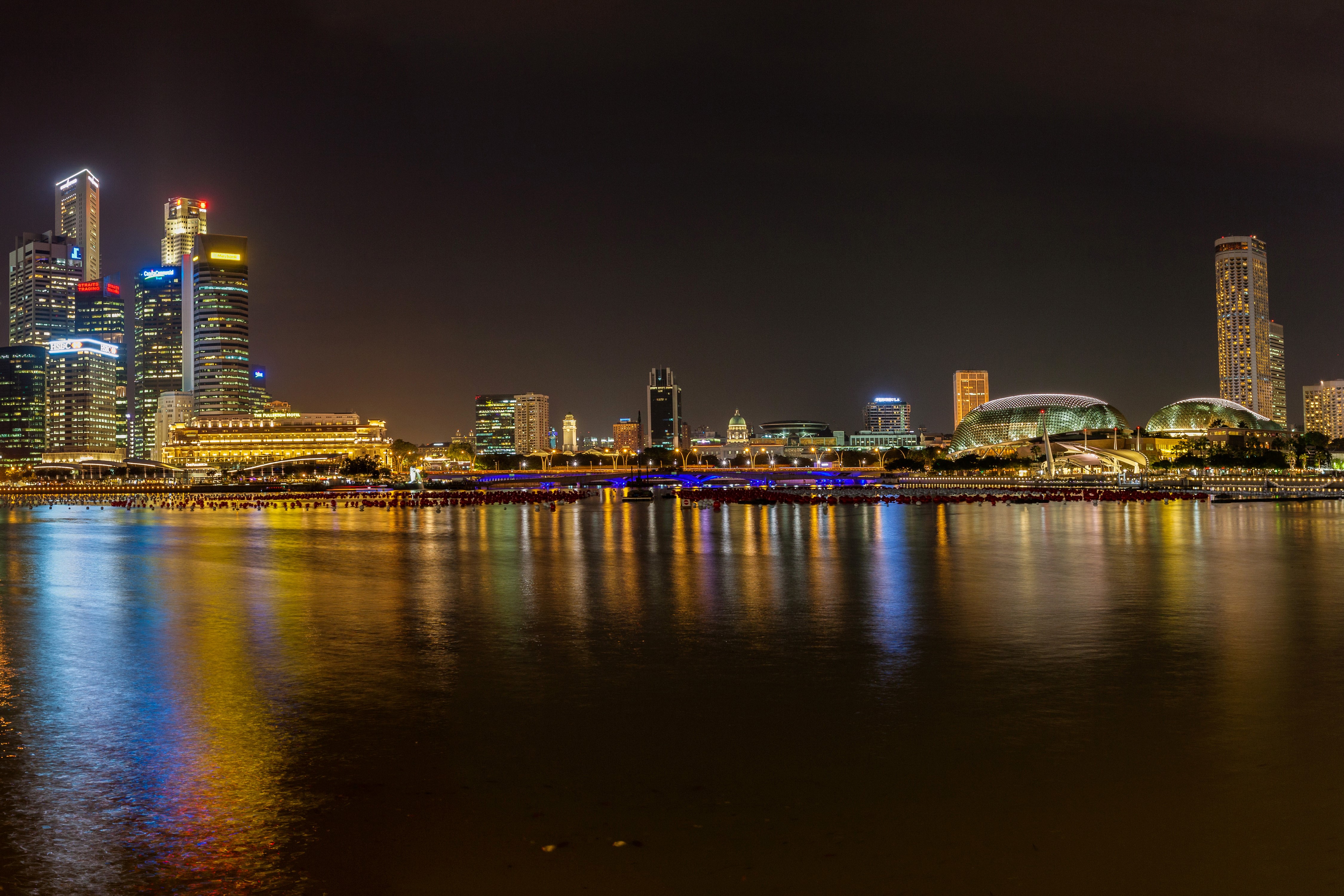 Singapore skyline at night with river reflections HD Wallpaper