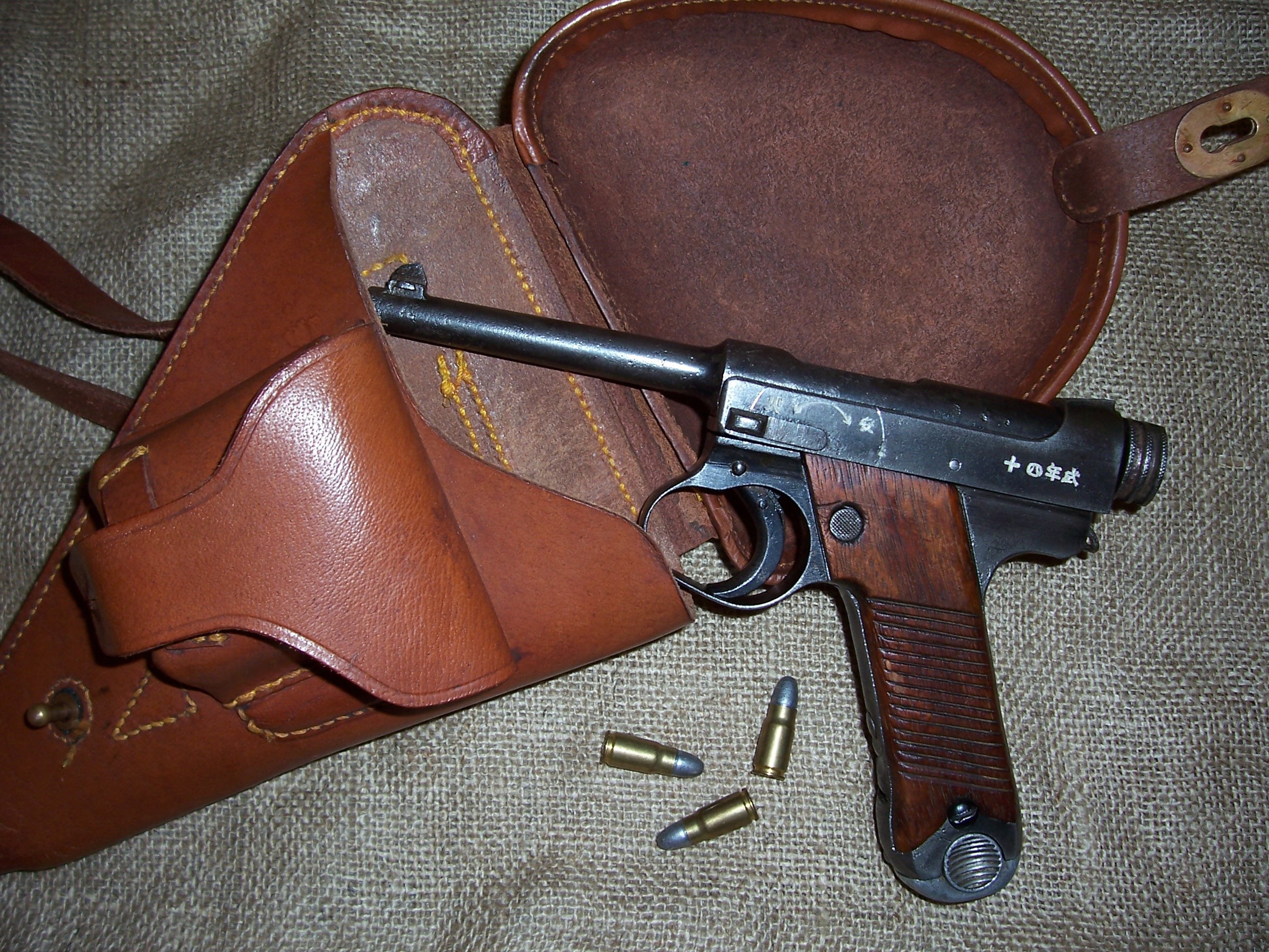 Japanese Nambu pistol with holster and ammunition HD Wallpaper