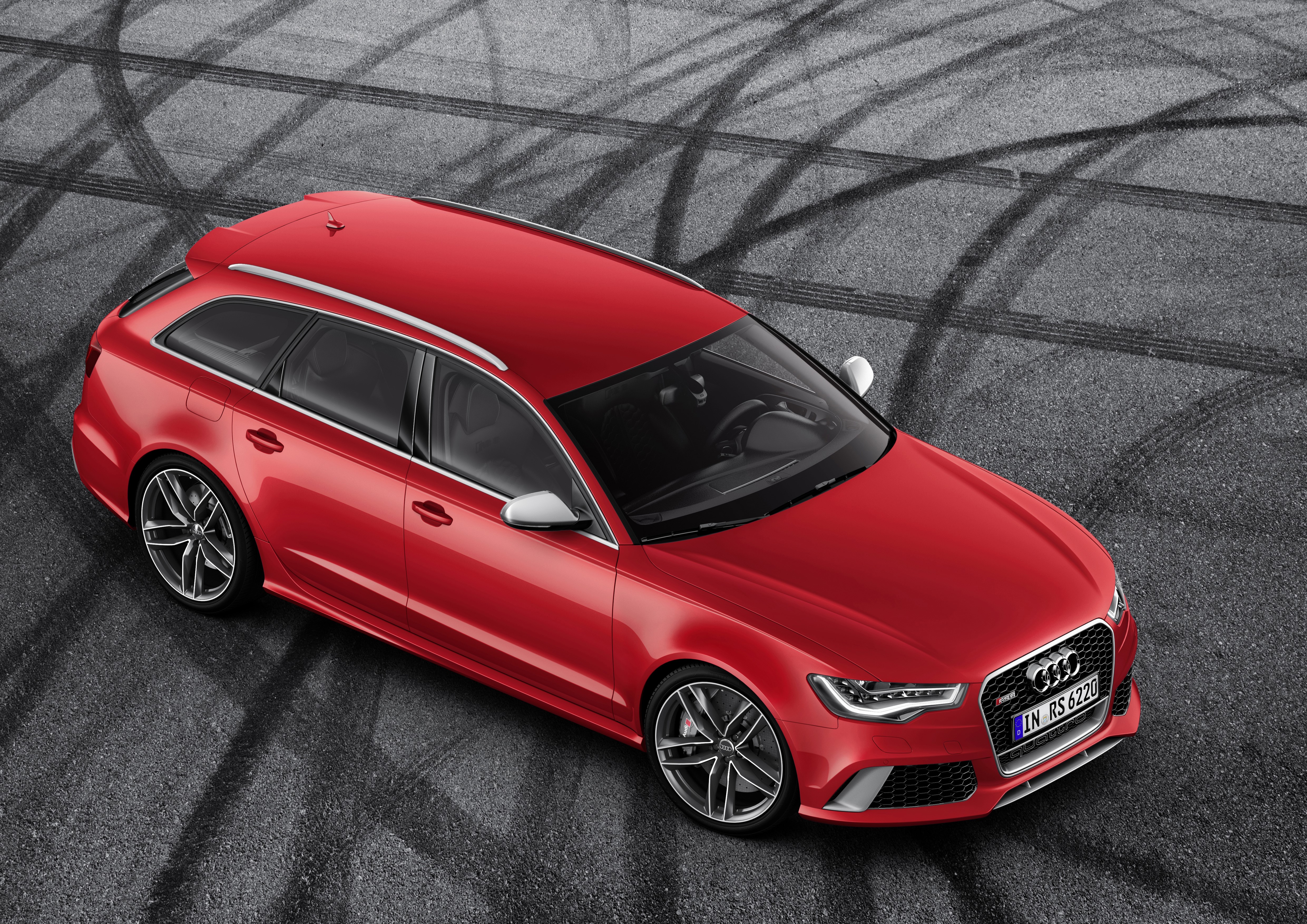 Red Audi RS6 Avant on asphalt with tire marks HD Wallpaper