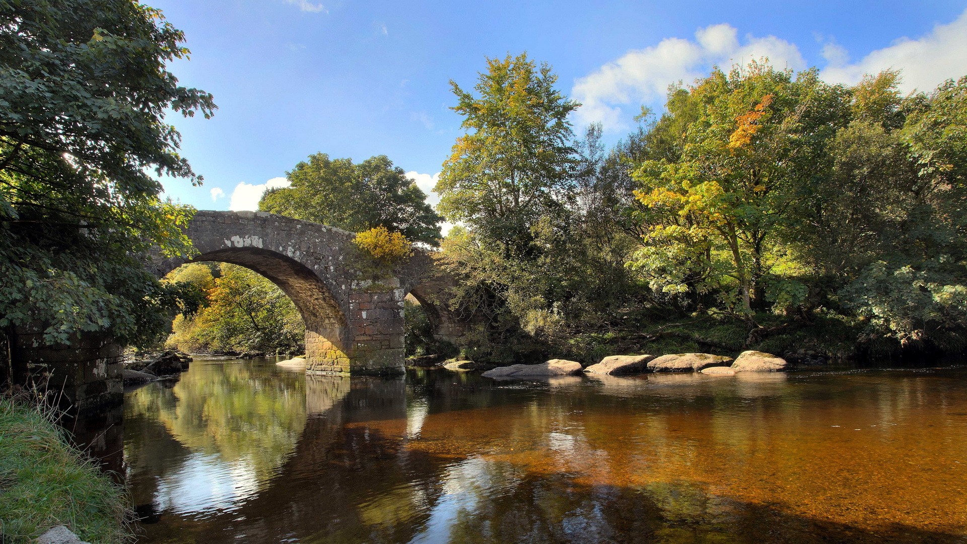 Stone bridge over a river with autumn trees HD Wallpaper