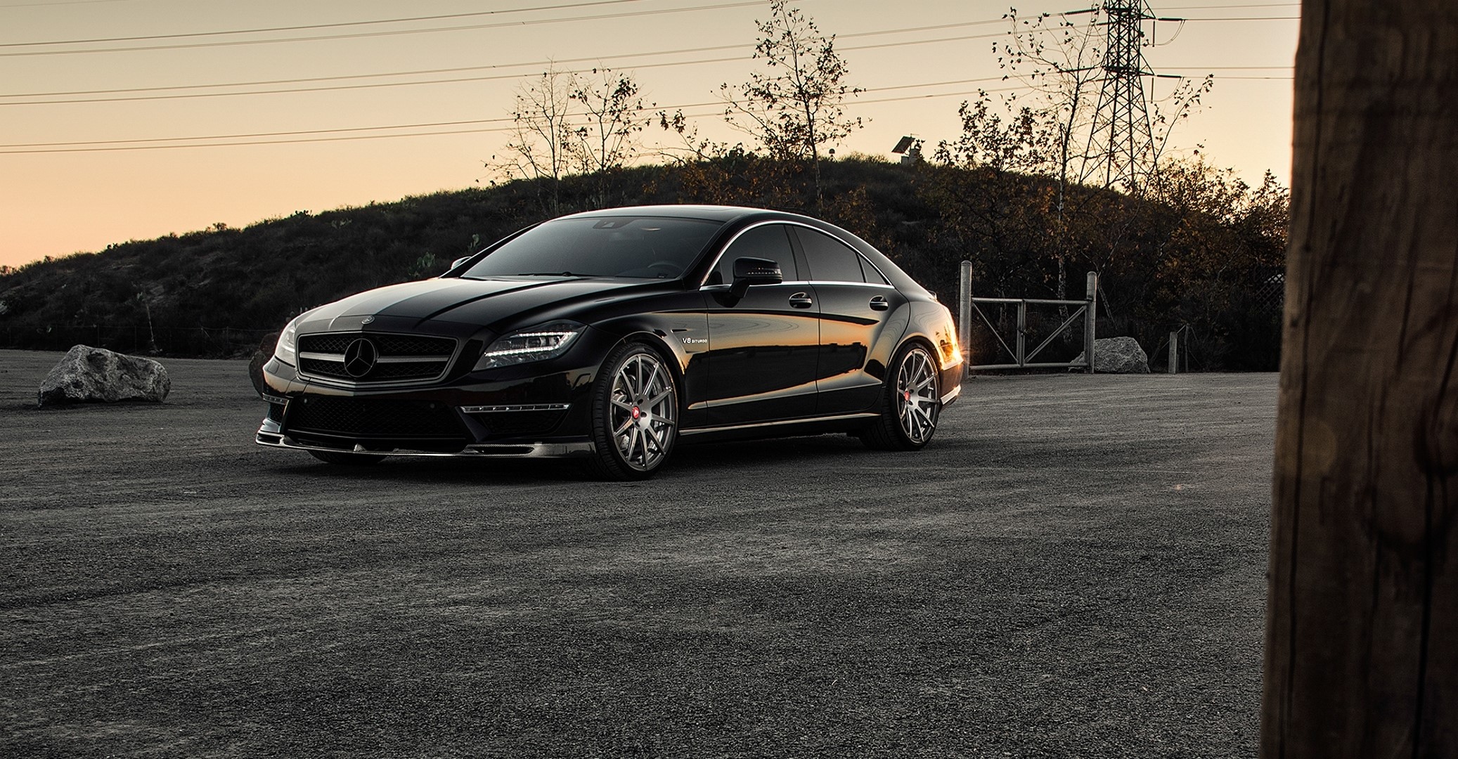 Black Mercedes-Benz CLS 63 AMG parked outdoors HD Wallpaper