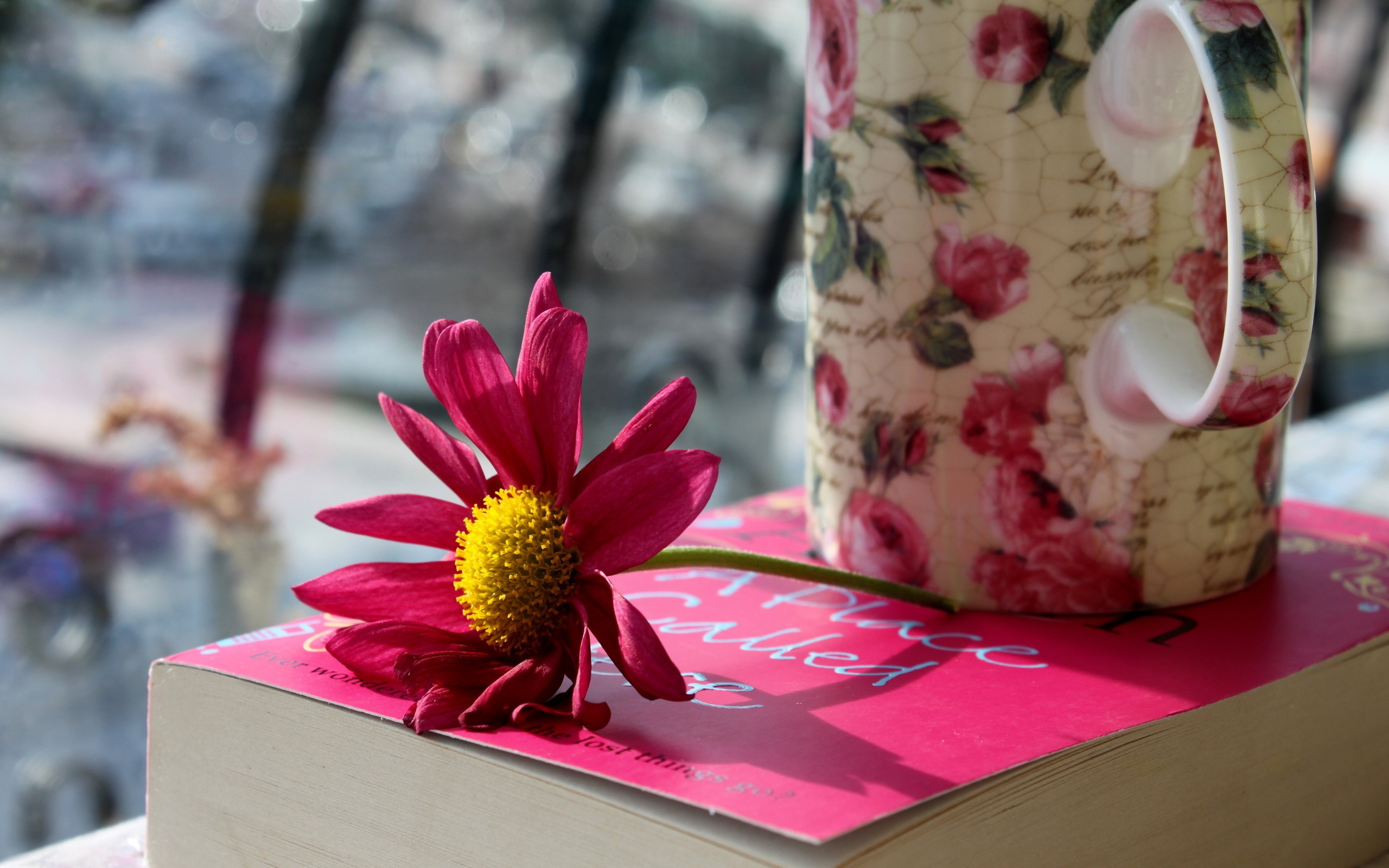Pink flower on a book next to a floral mug HD Wallpaper
