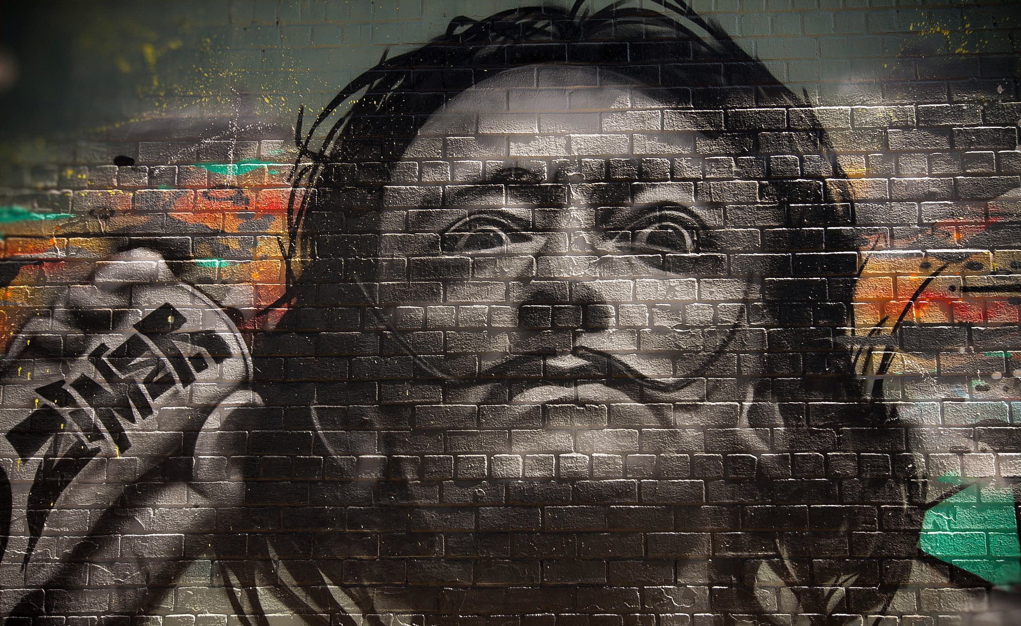 Graffiti portrait of Salvador Dali on a brick wall HD Wallpaper
