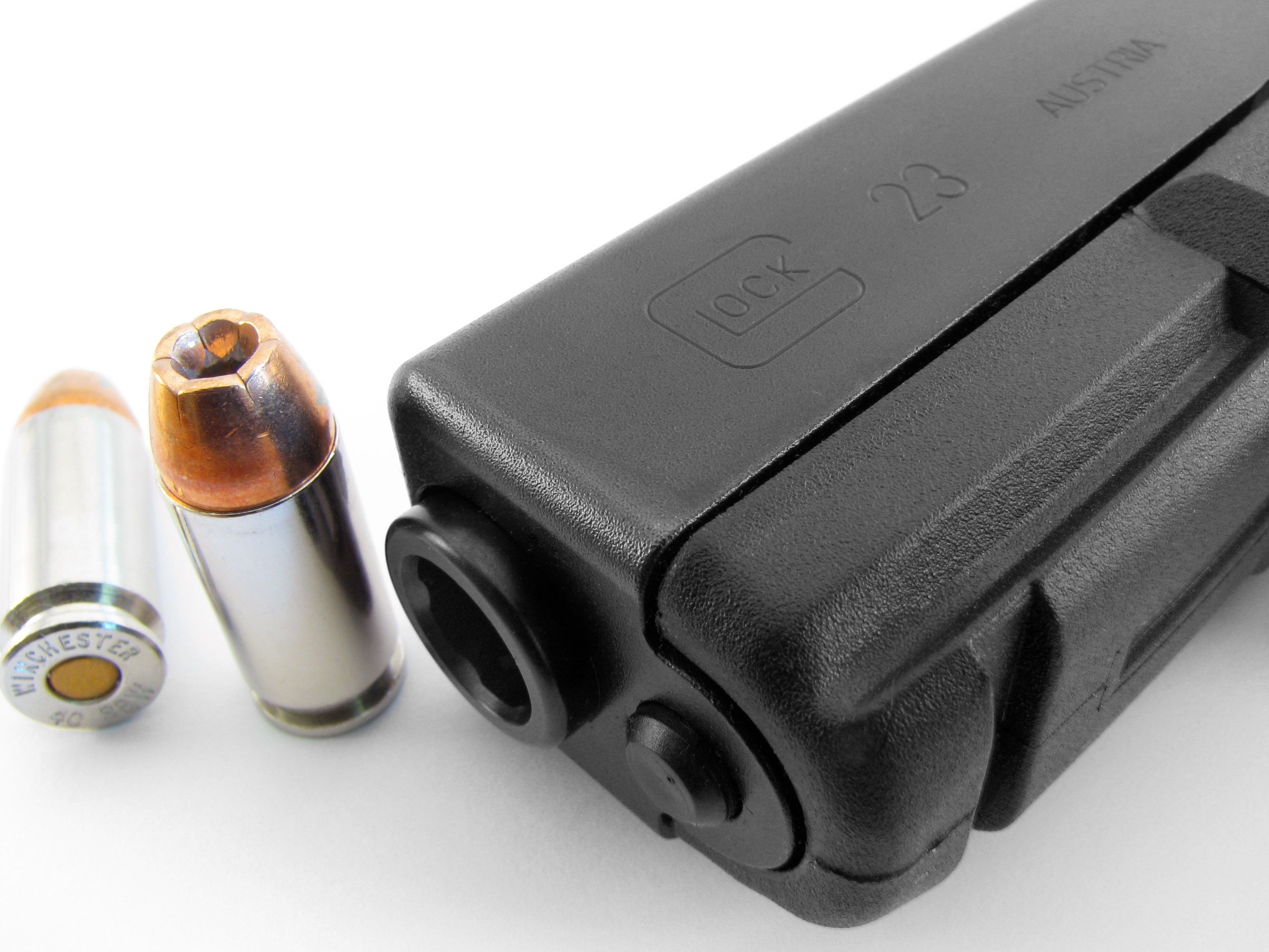 Glock 23 pistol with ammunition HD Wallpaper