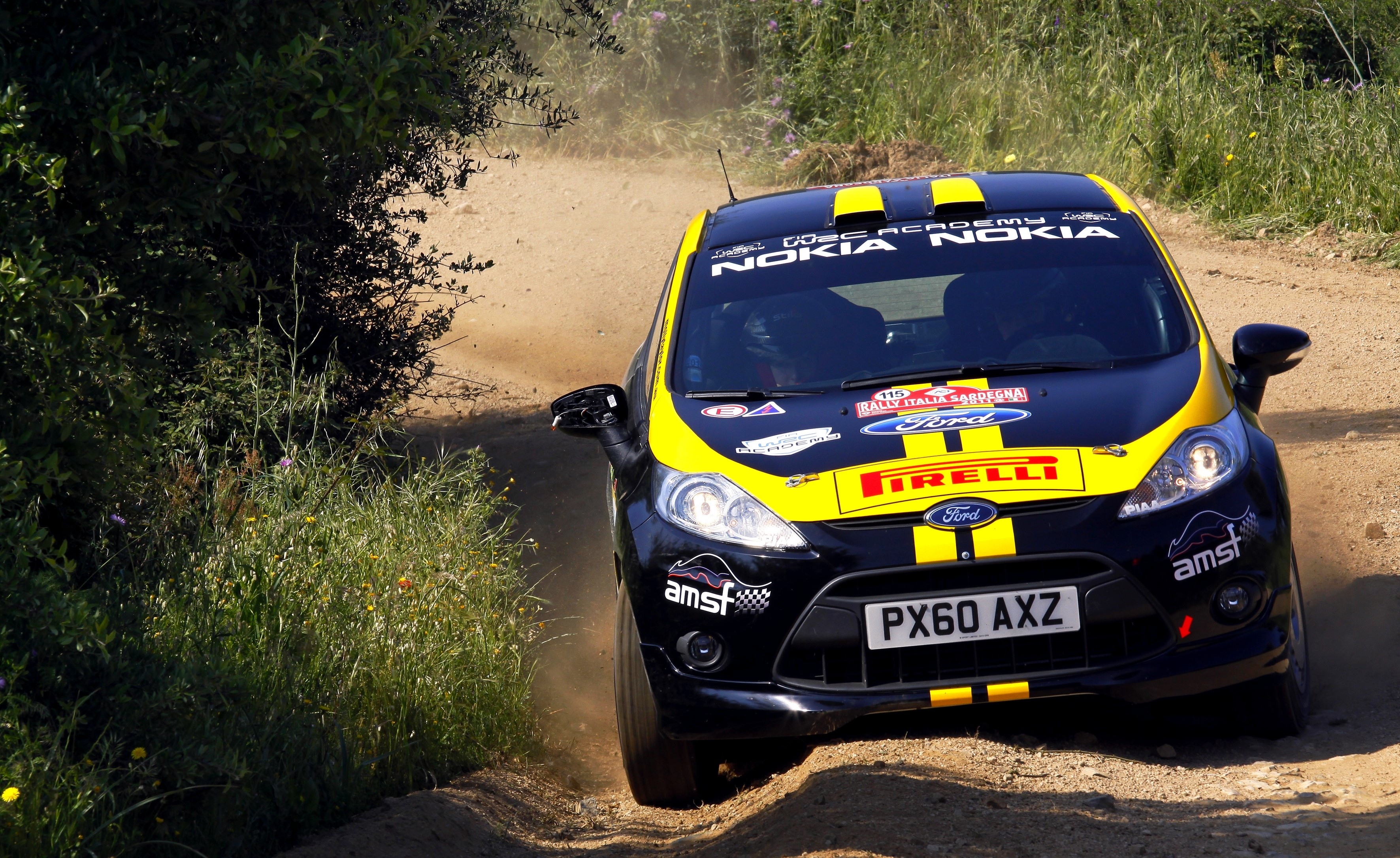 Ford Fiesta WRC car on a dirt road HD Wallpaper