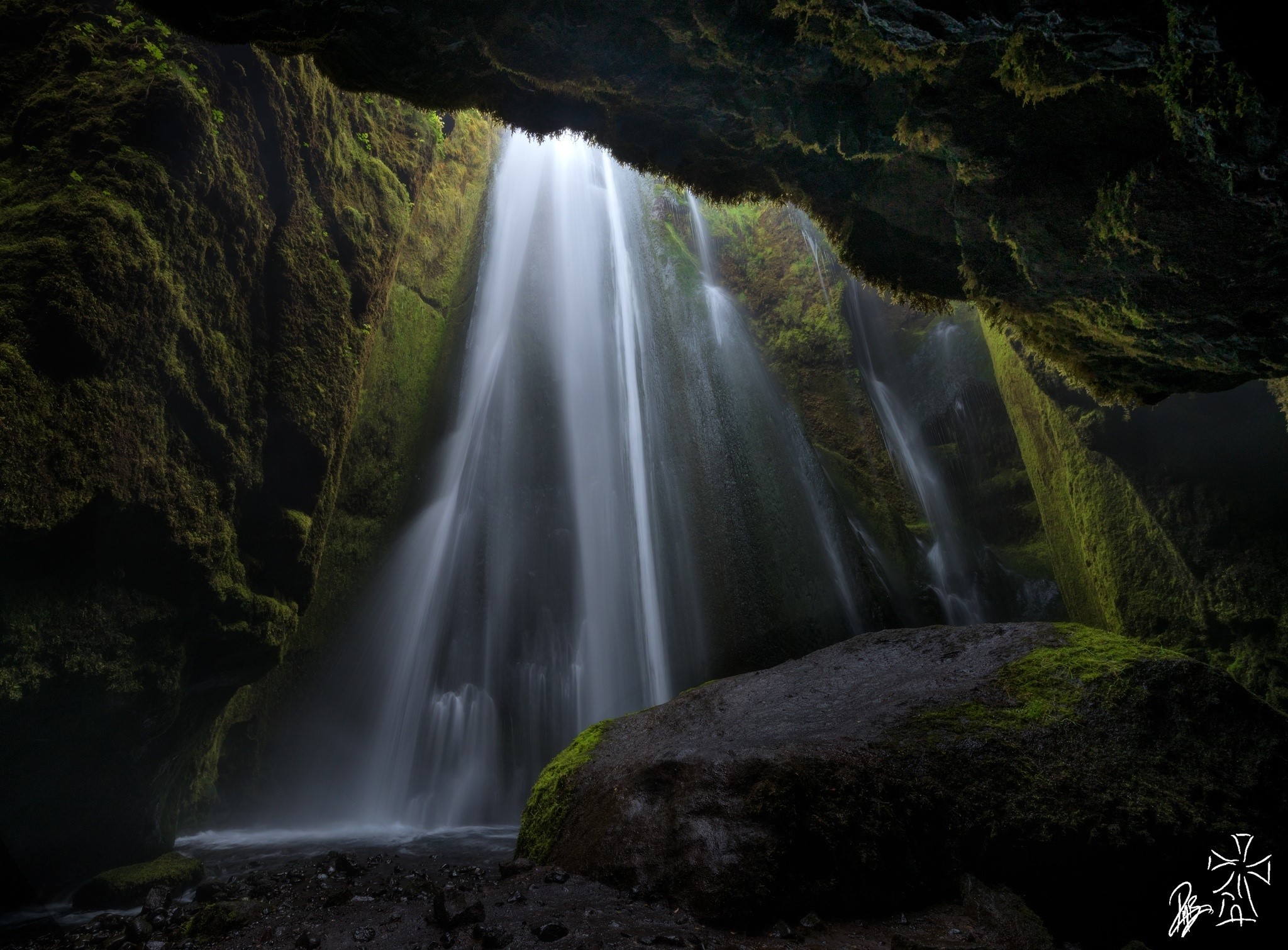 Mossy cave with a waterfall HD Wallpaper