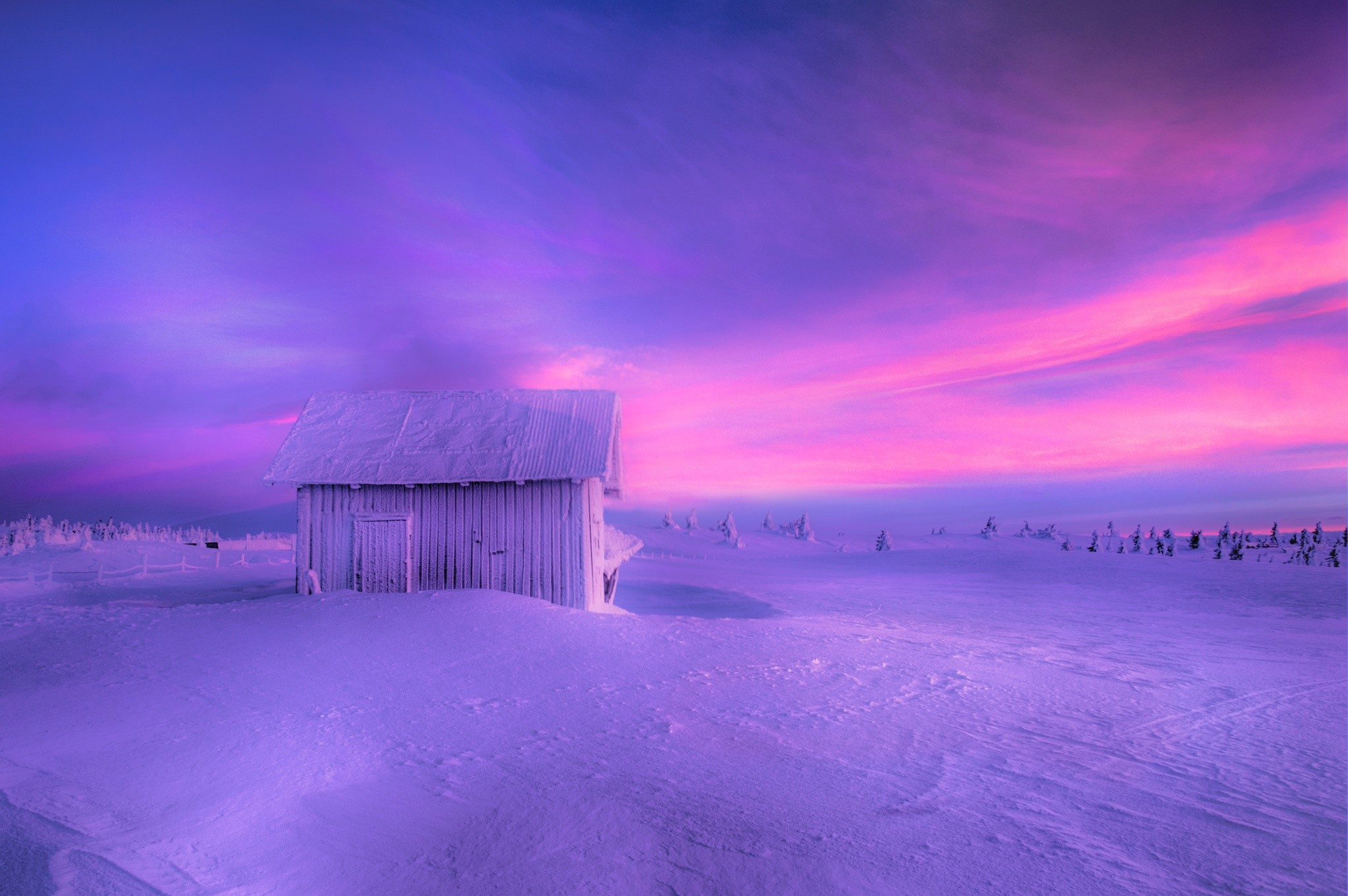 Wooden house in a snowy landscape during sunset HD Wallpaper