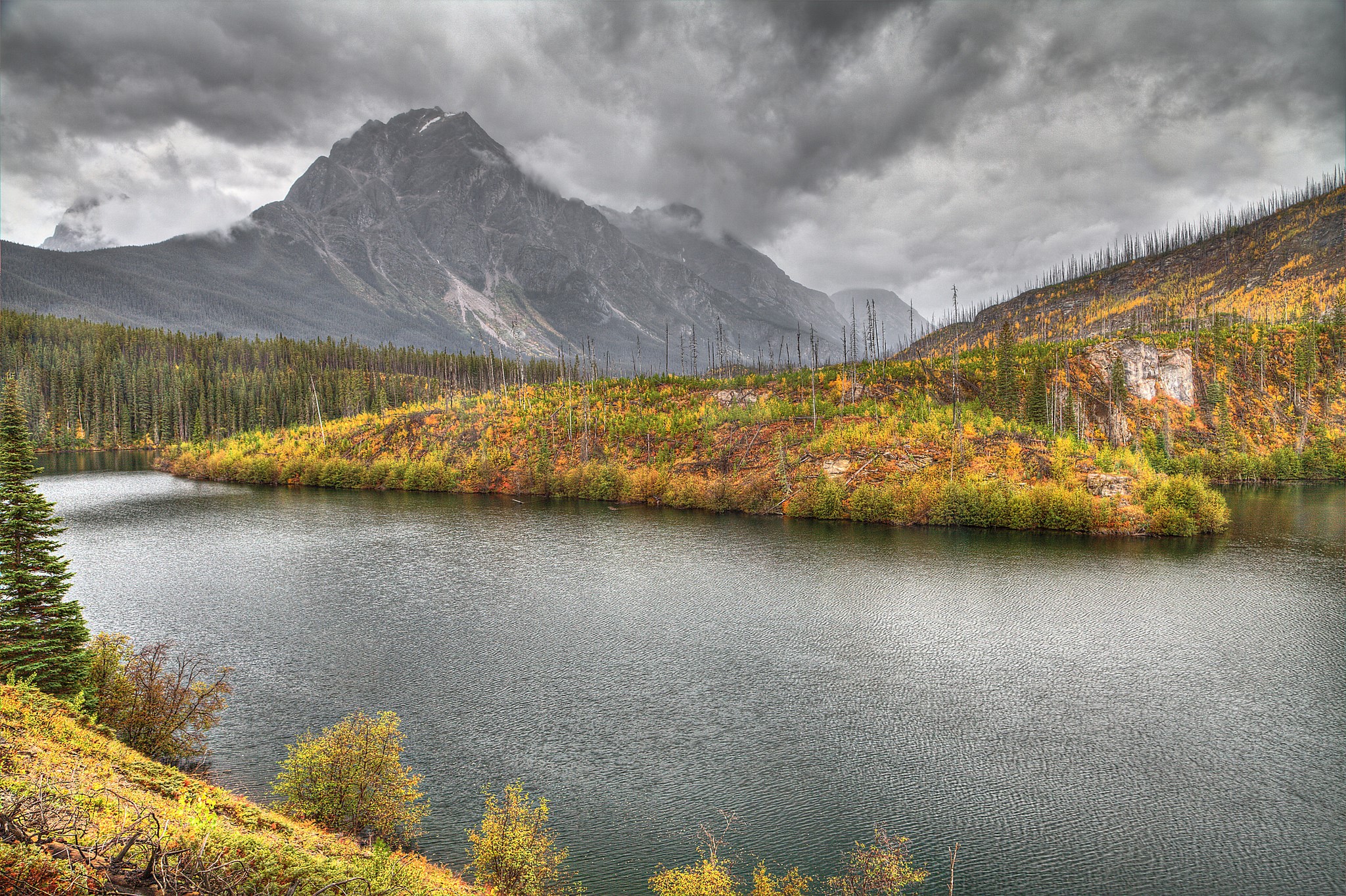 Autumn lake and mountains under cloudy sky HD Wallpaper