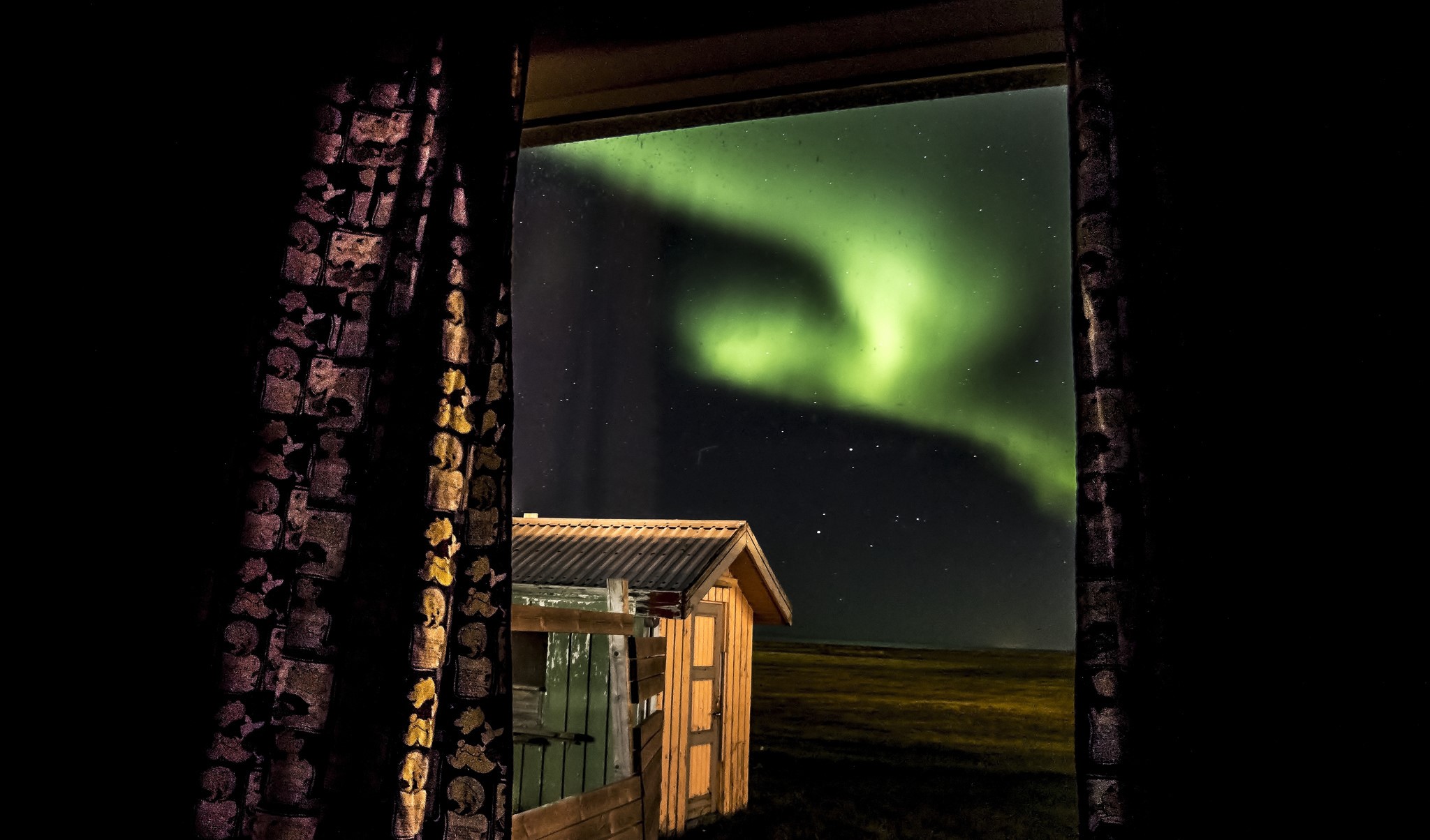 Aurora Borealis seen through a window HD Wallpaper