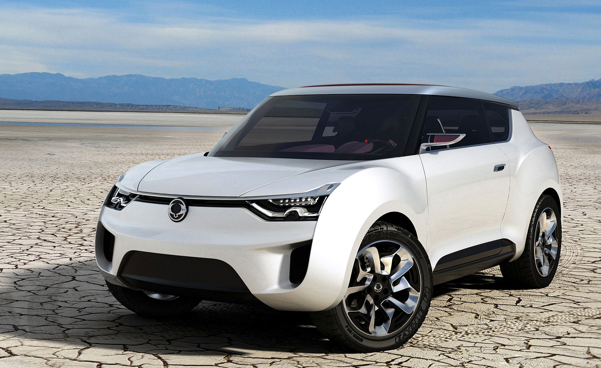 White SsangYong concept car in desert landscape HD Wallpaper