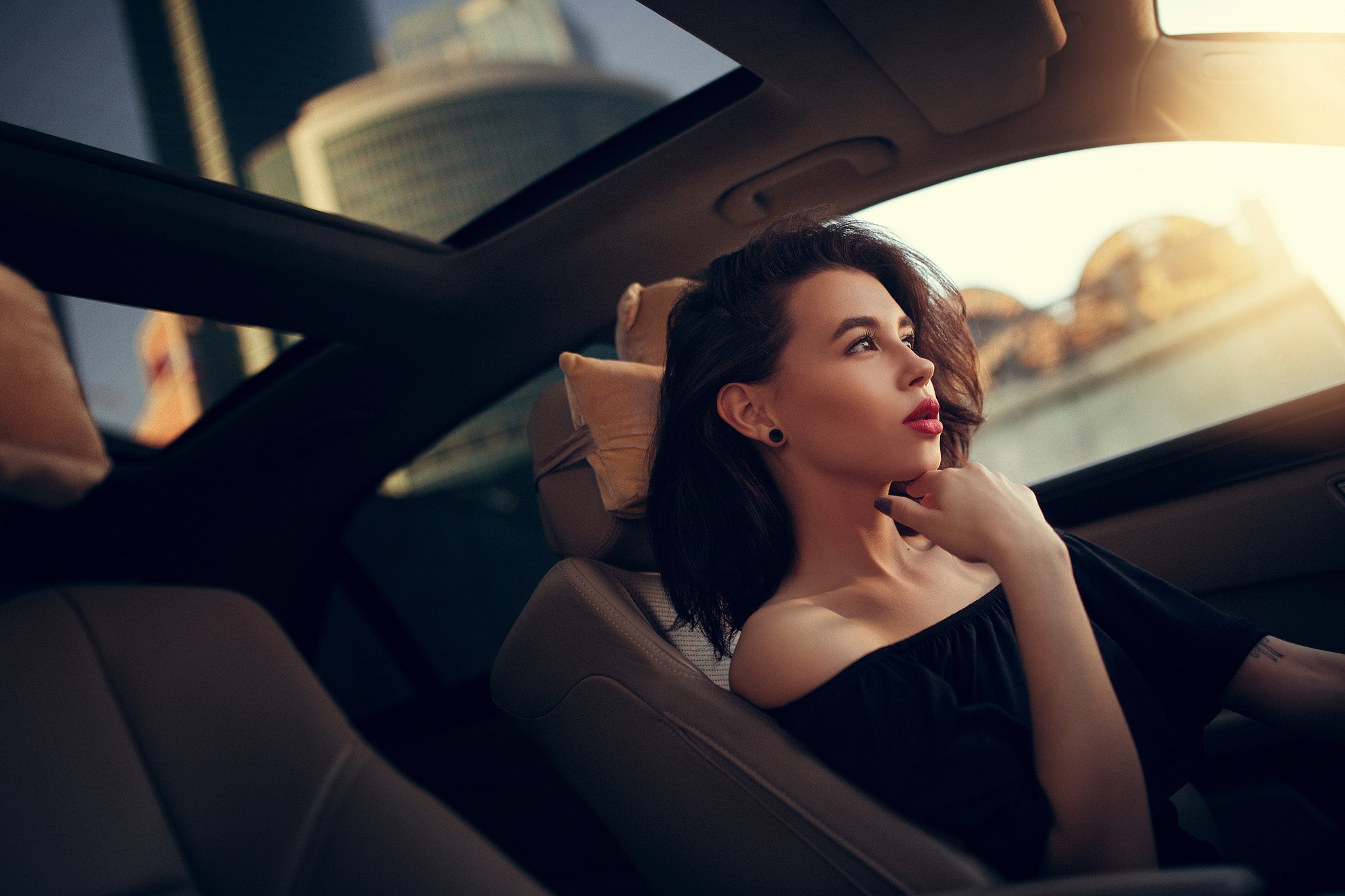 Woman in car with sunroof HD Wallpaper