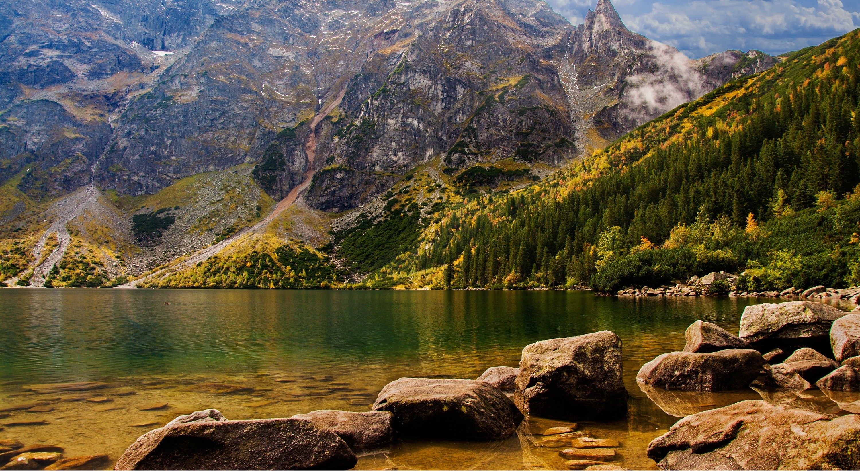 Lake and mountains with autumn trees and rocks HD Wallpaper