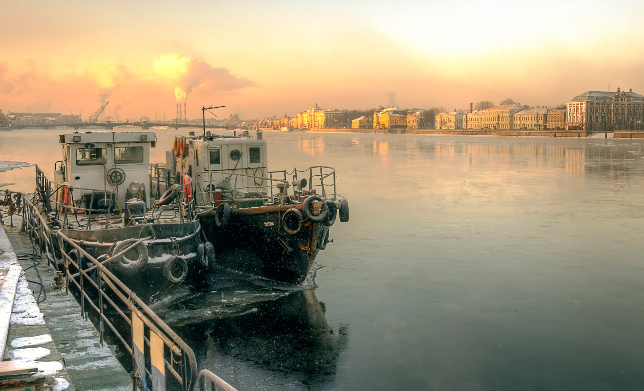 Ships docked on a frozen river in St. Petersburg, Russia HD Wallpaper