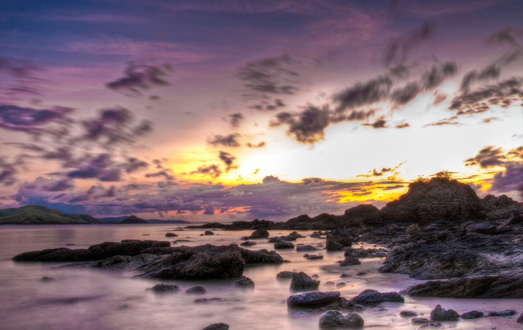 Rocky Shoreline at Sunset with Dramatic Clouds HD Wallpaper