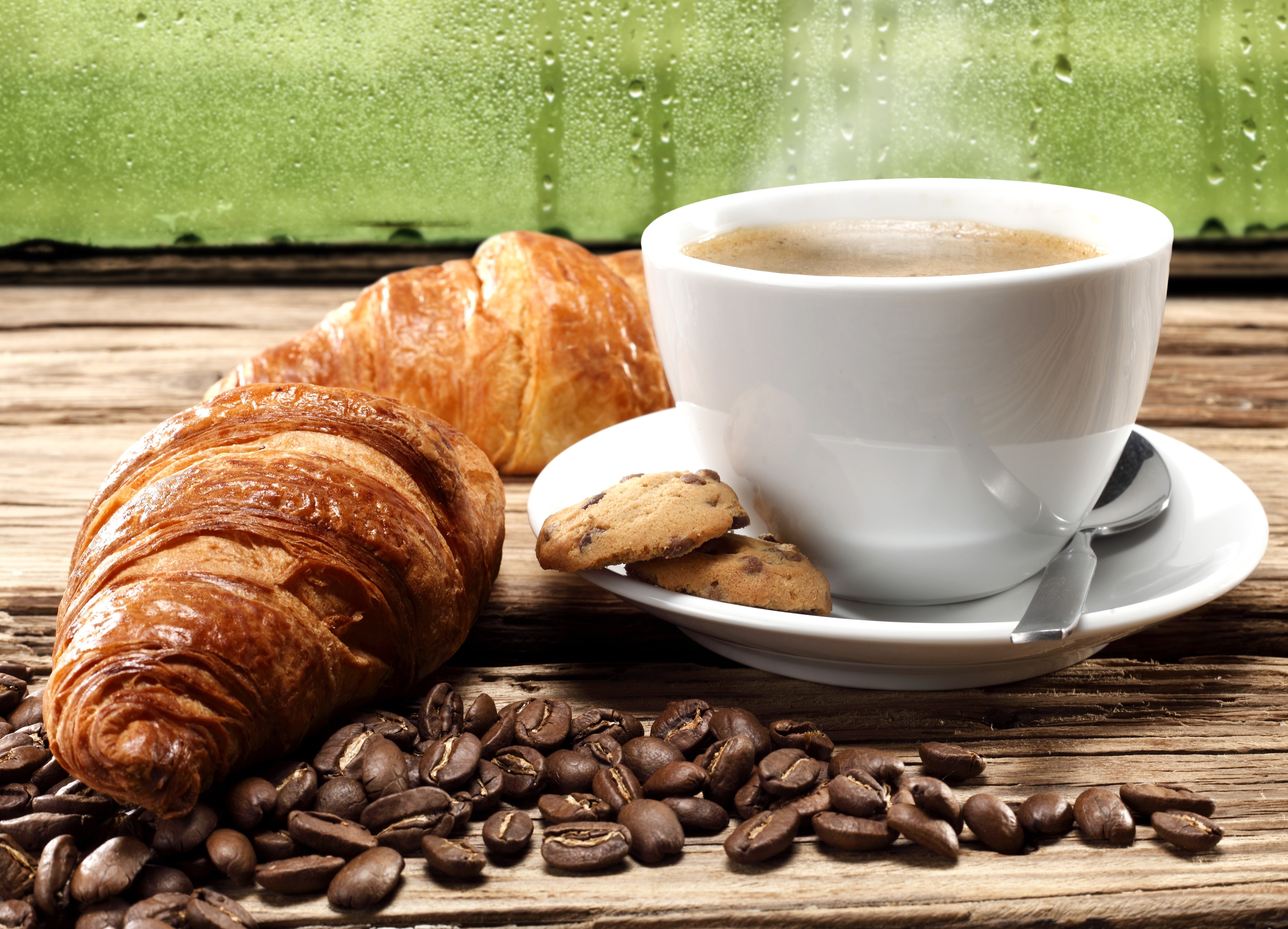Croissants and coffee with cookies on a wooden table HD Wallpaper
