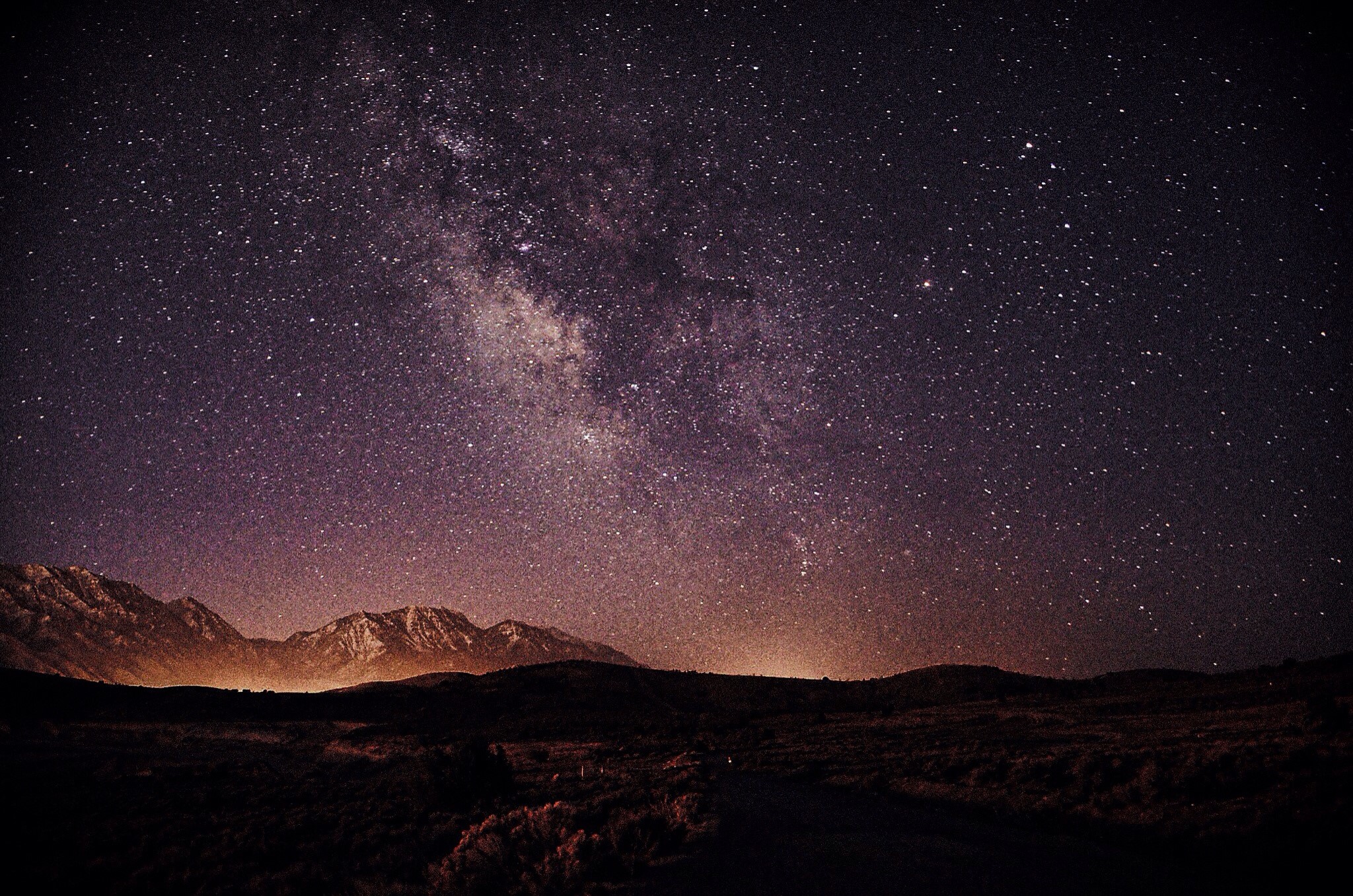 Milky Way galaxy over mountains at night HD Wallpaper