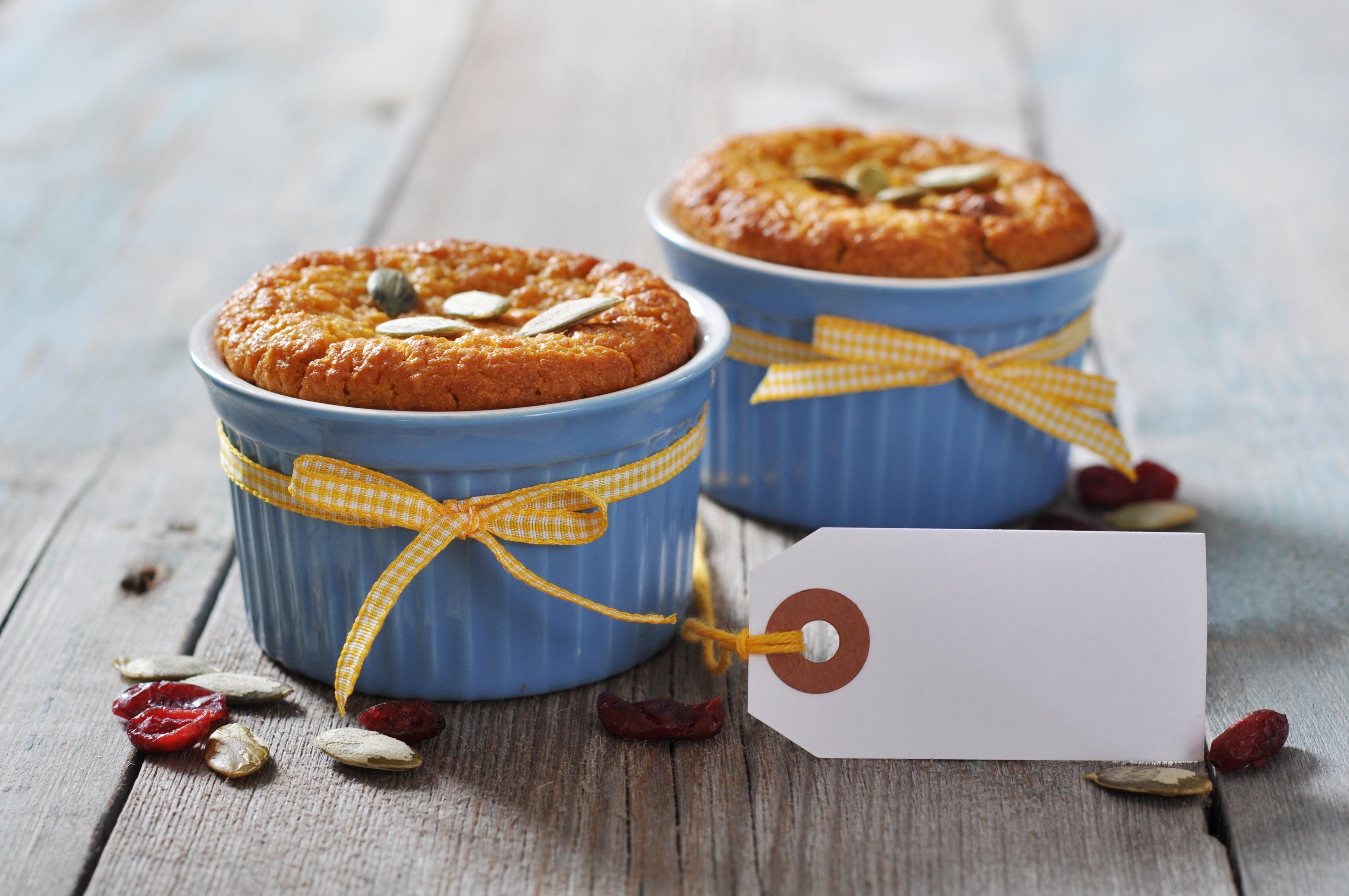Two muffins with pumpkin seeds and cranberries HD Wallpaper