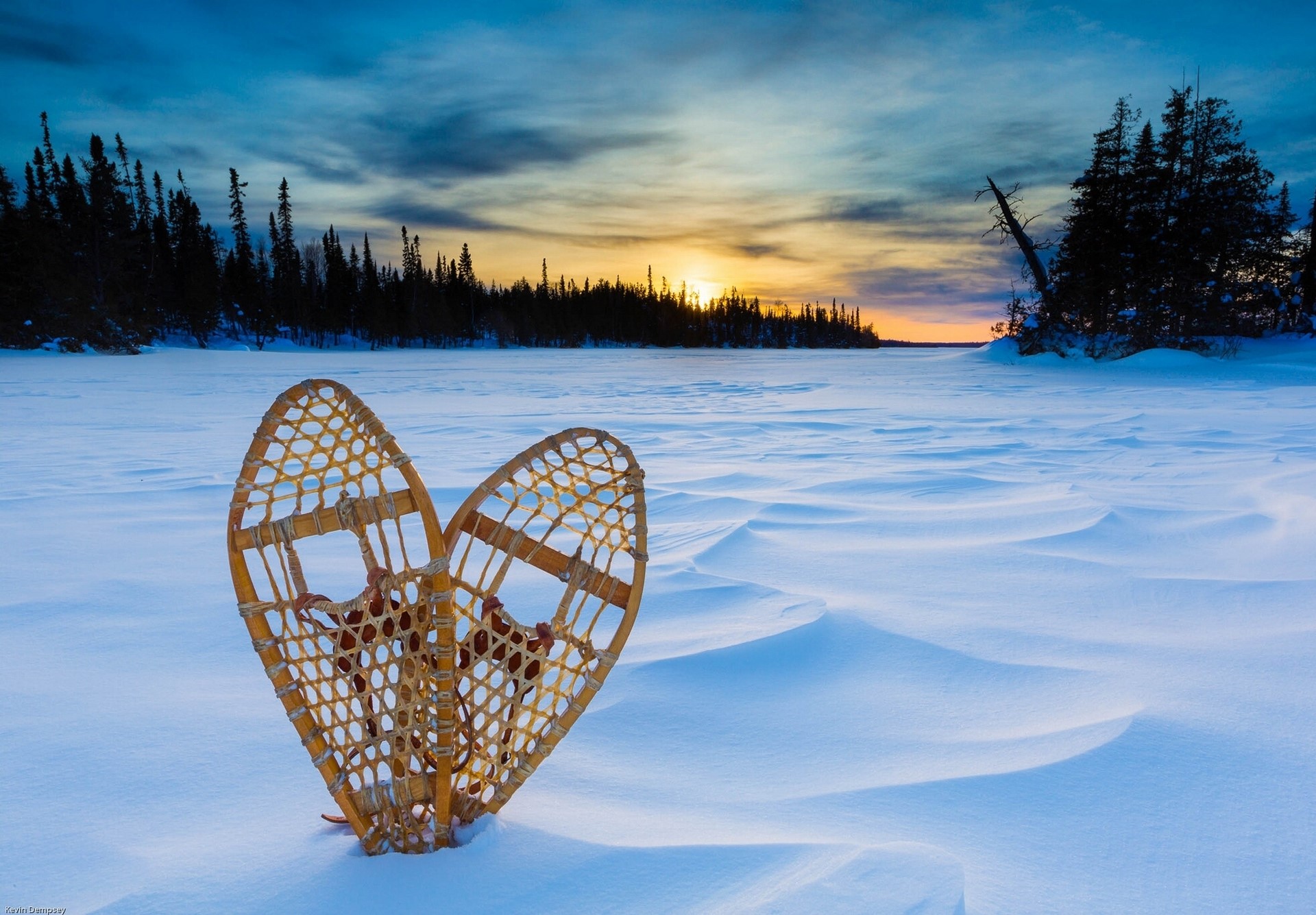 Snowshoes on a Snowy Landscape at Sunset HD Wallpaper