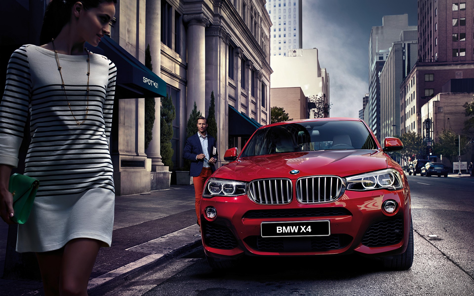 Red BMW X4 on a city street with people HD Wallpaper