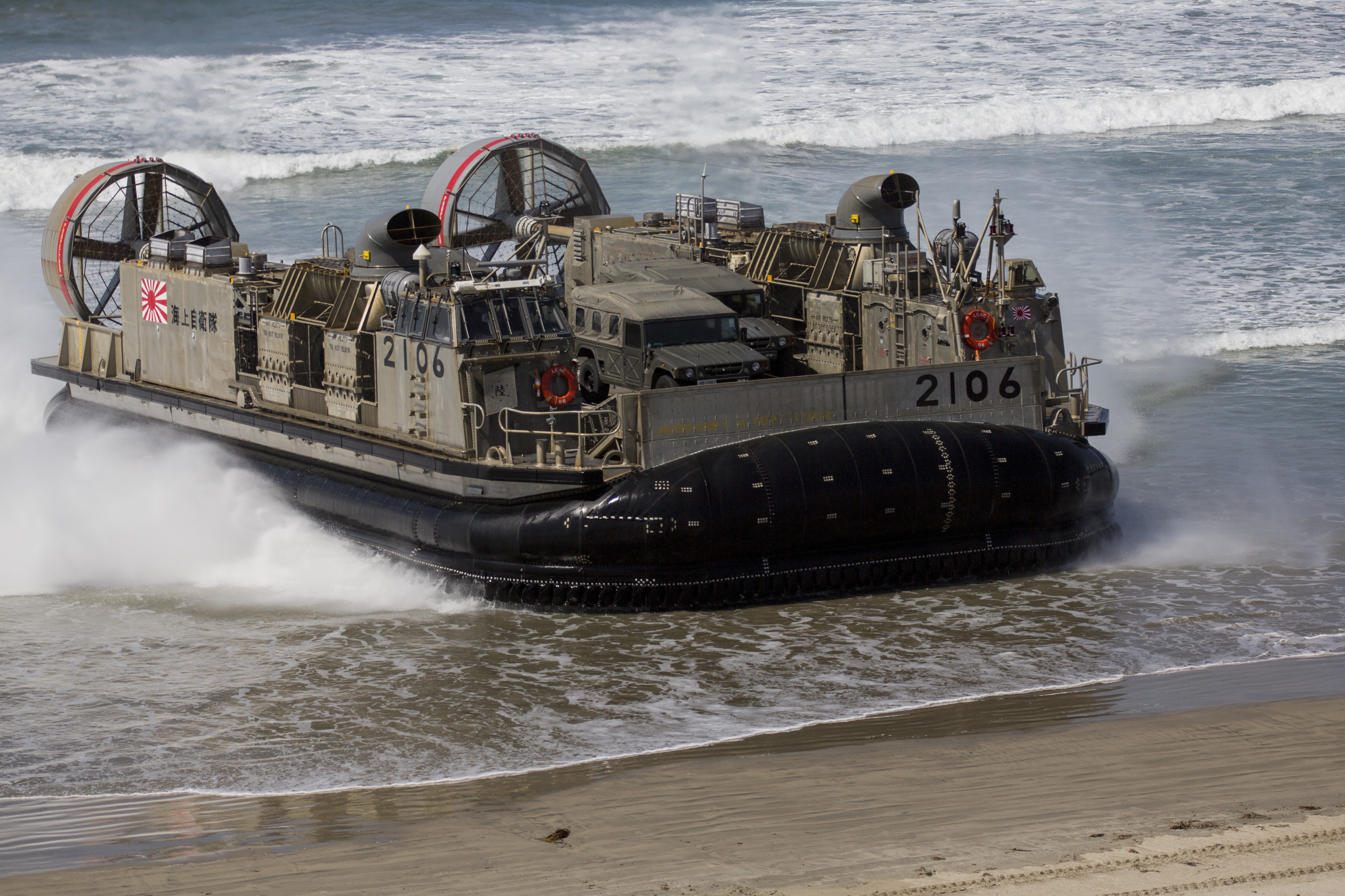 Japanese hovercraft 2106 approaching a beach HD Wallpaper