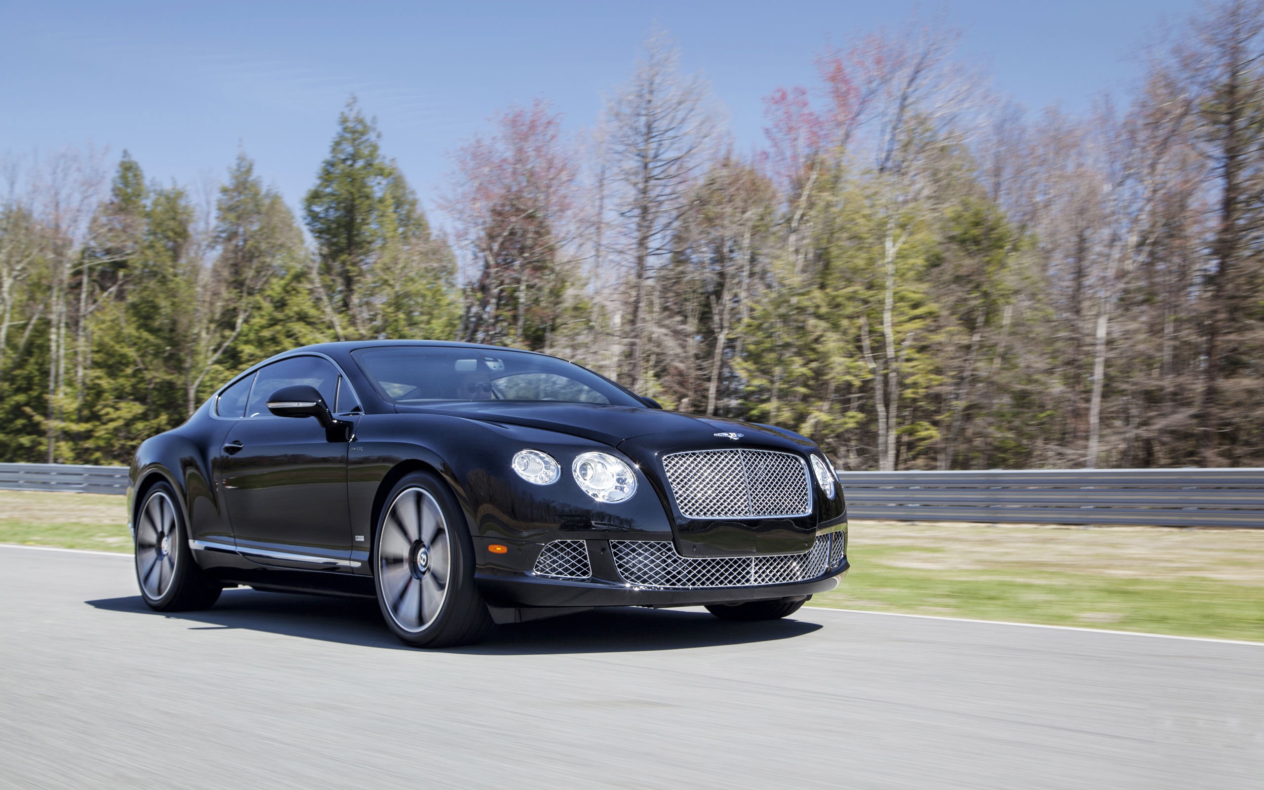 Black Bentley Continental GT driving on a road HD Wallpaper