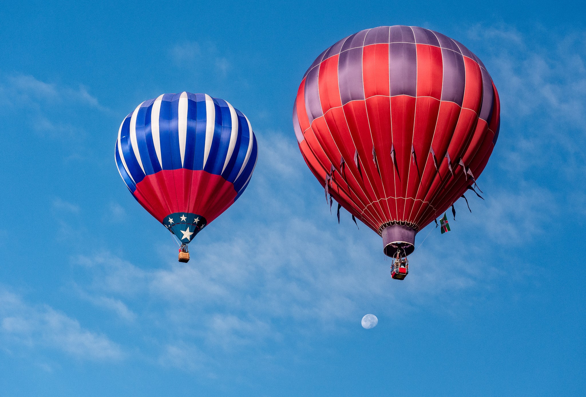 Two hot air balloons in a blue sky with clouds HD Wallpaper
