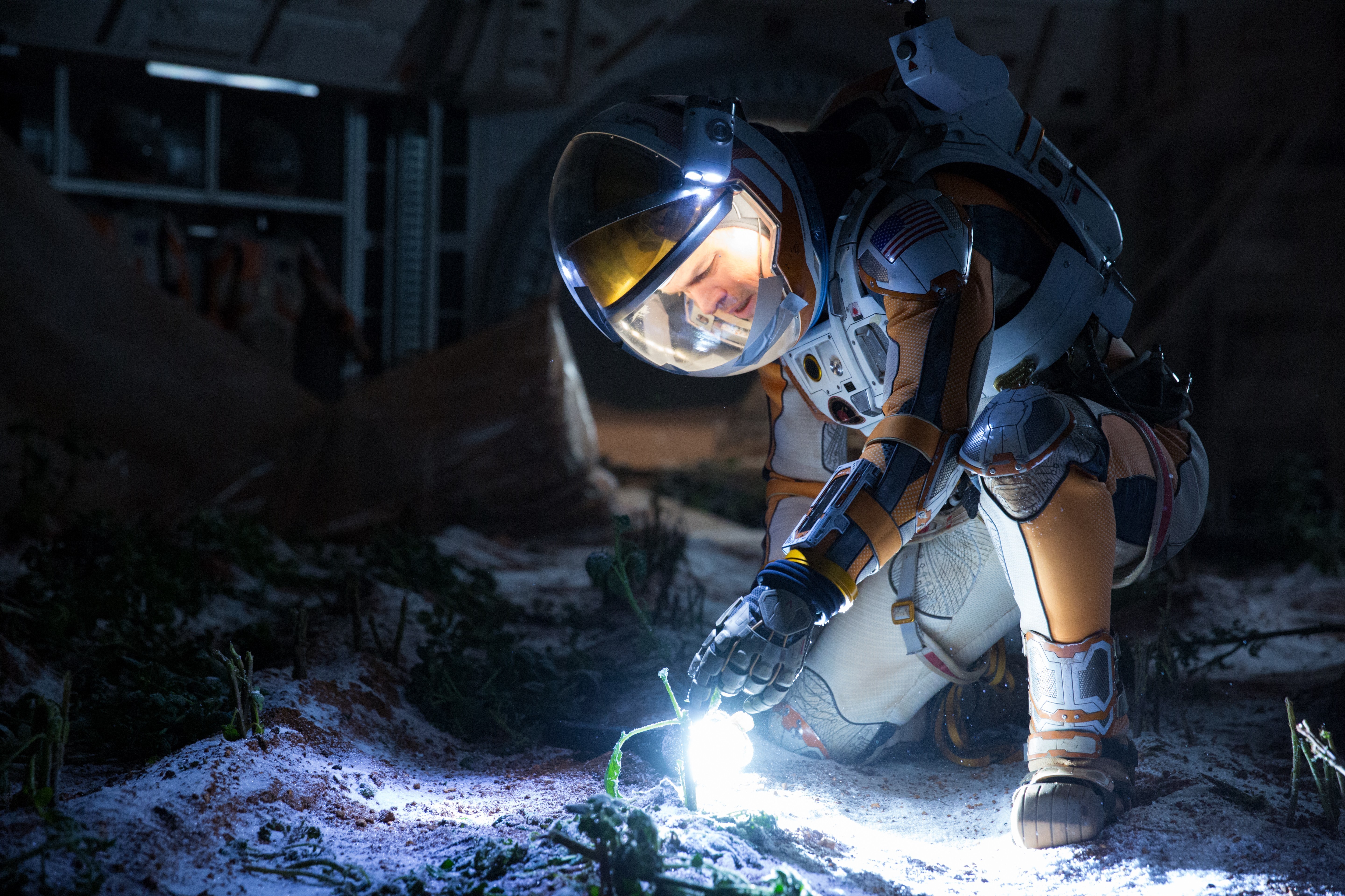 Astronaut from The Martian tending to plants HD Wallpaper