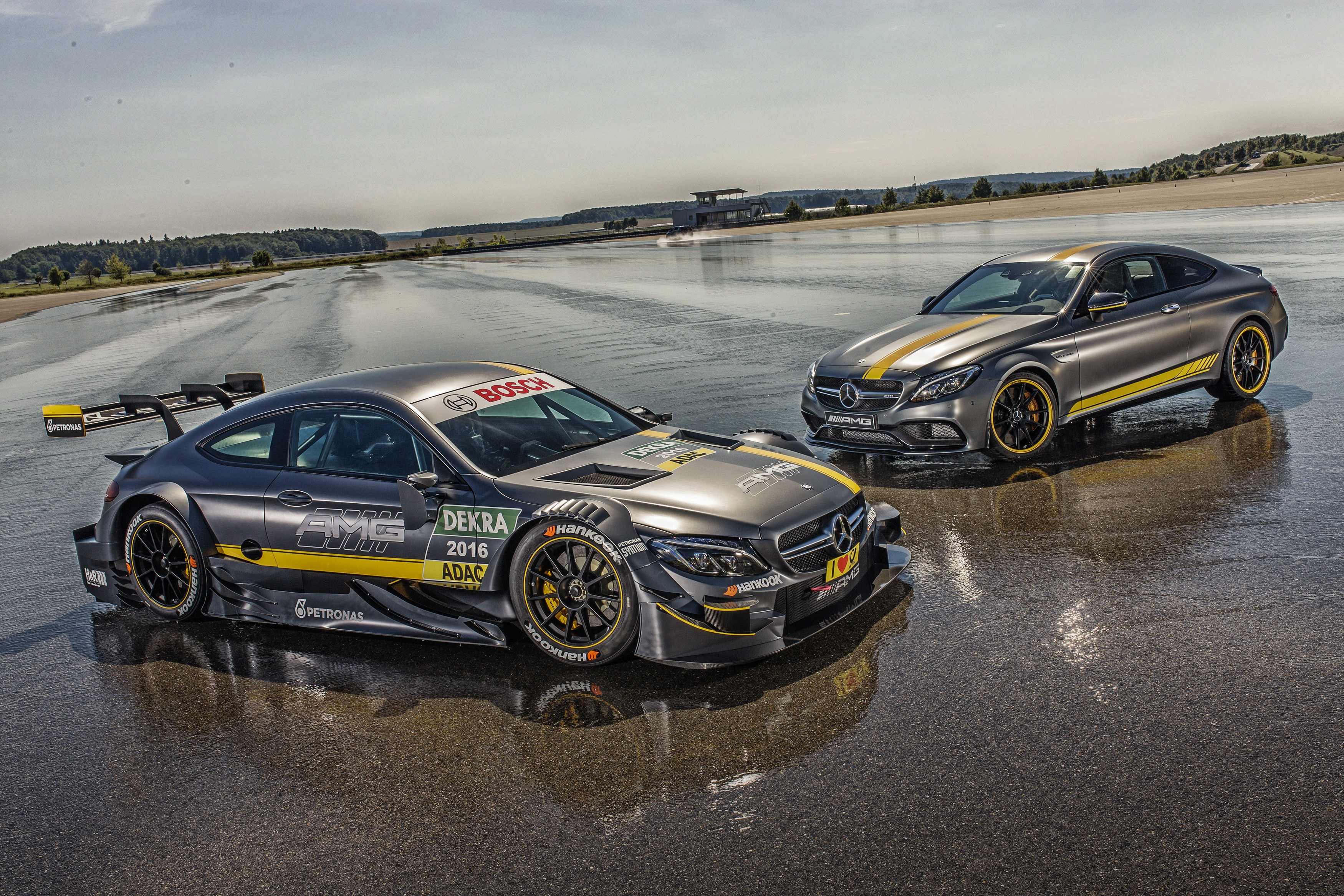 Mercedes-Benz AMG C 63 DTM race cars on wet track HD Wallpaper