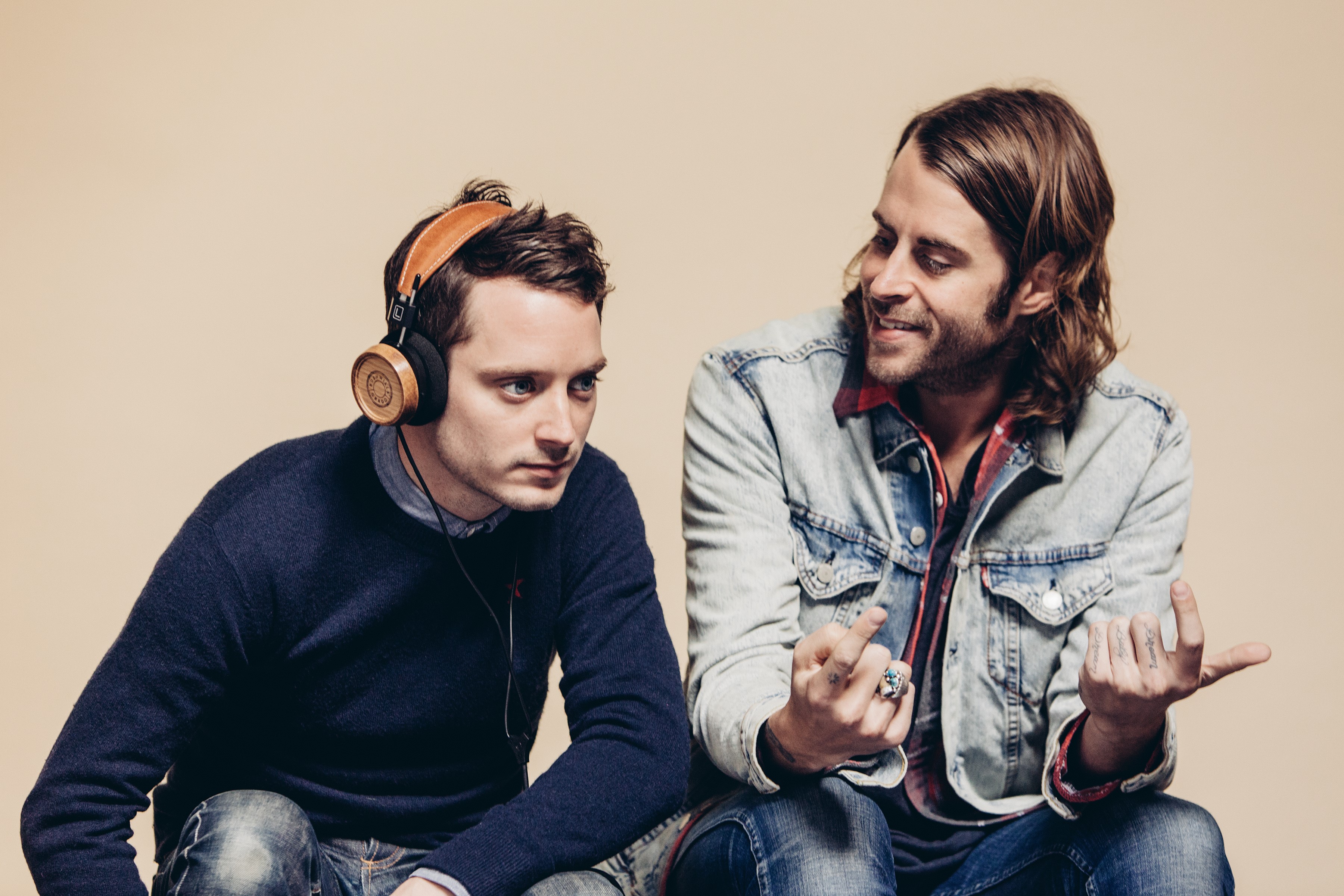 Elijah Wood and Zach Cowie with Grado Labs headphones HD Wallpaper