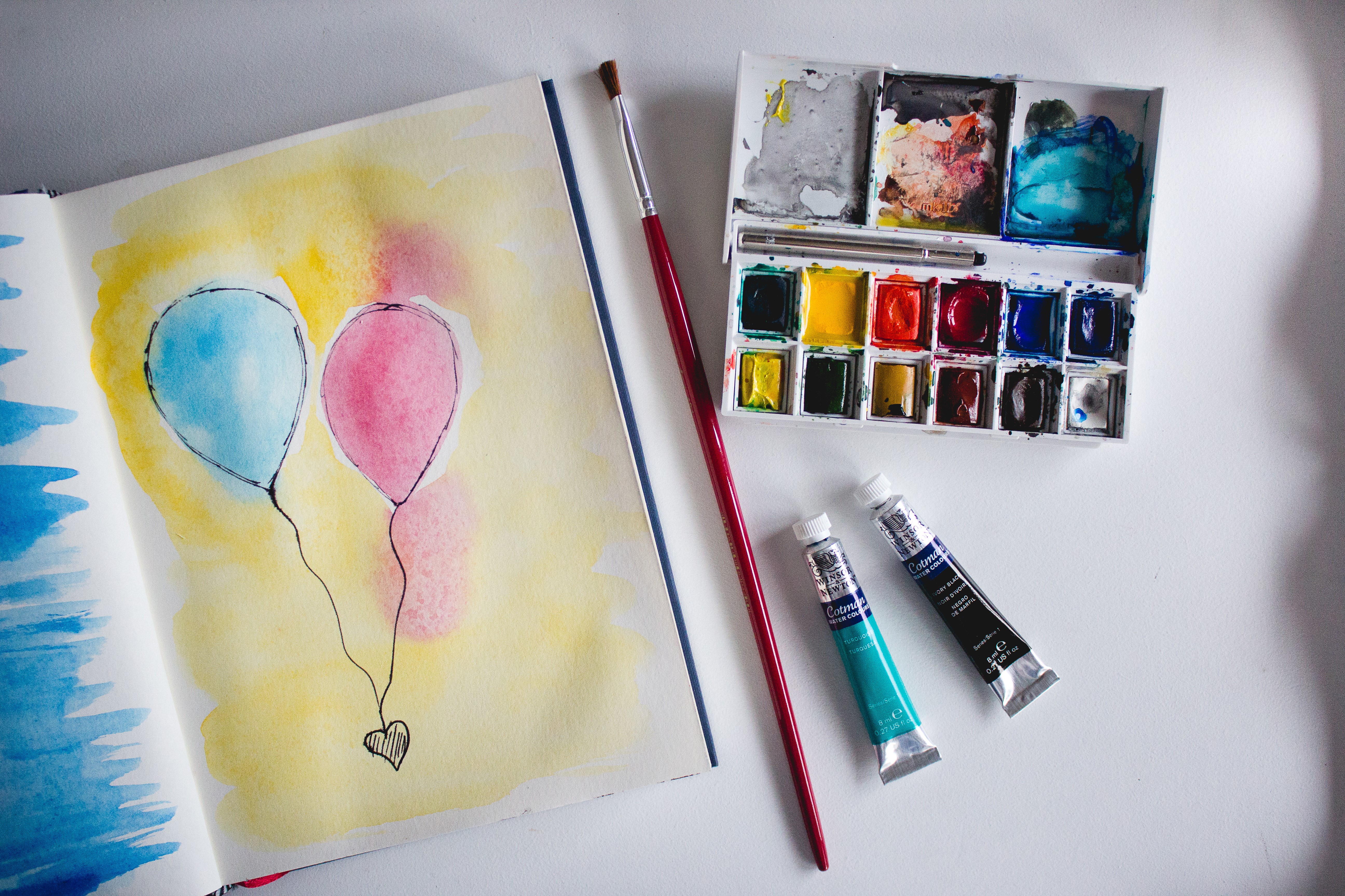 Watercolor painting of balloons with art supplies HD Wallpaper