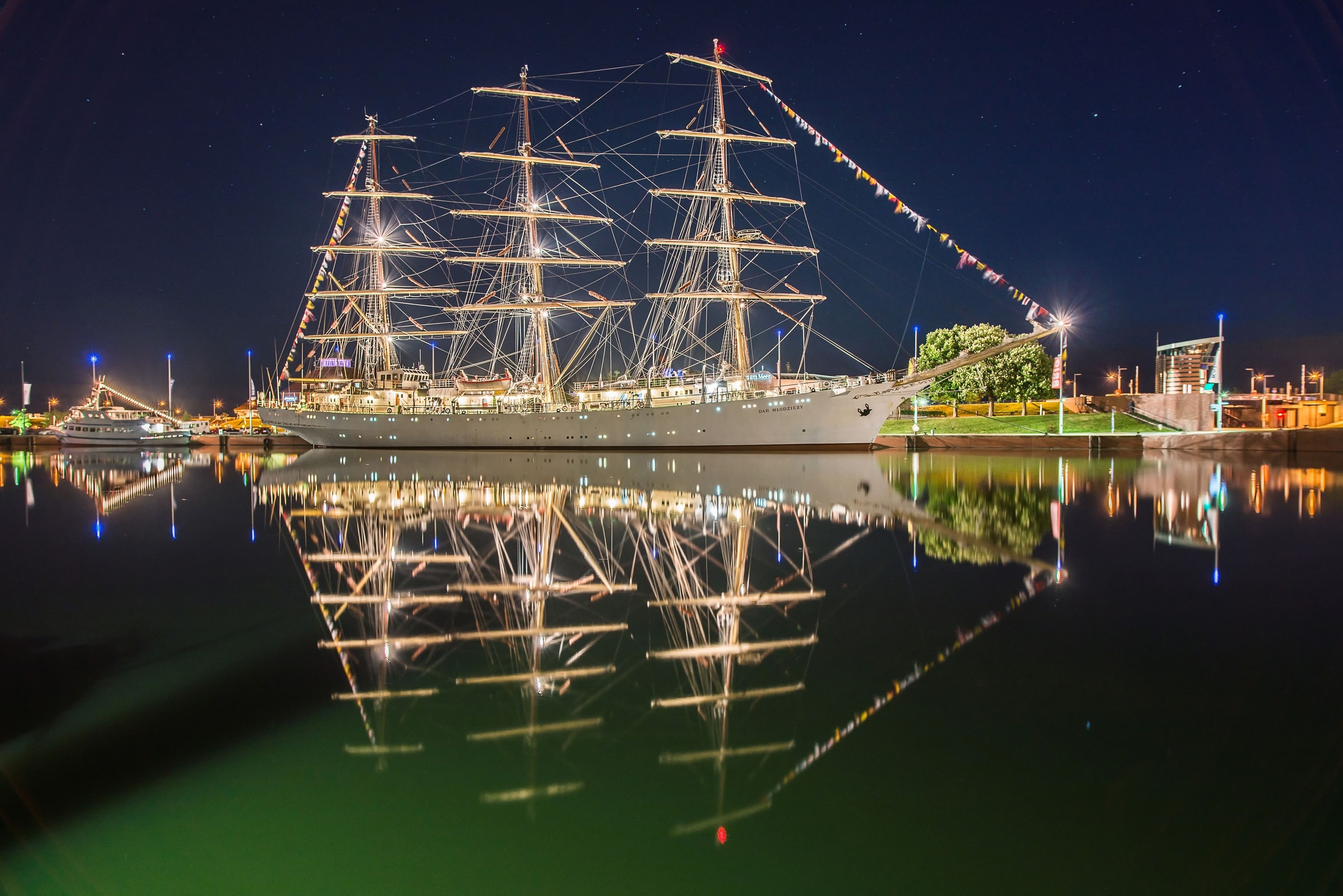 Dar Mlodziezy sailing ship docked at night on Weser River, Bremerhaven, Germany HD Wallpaper