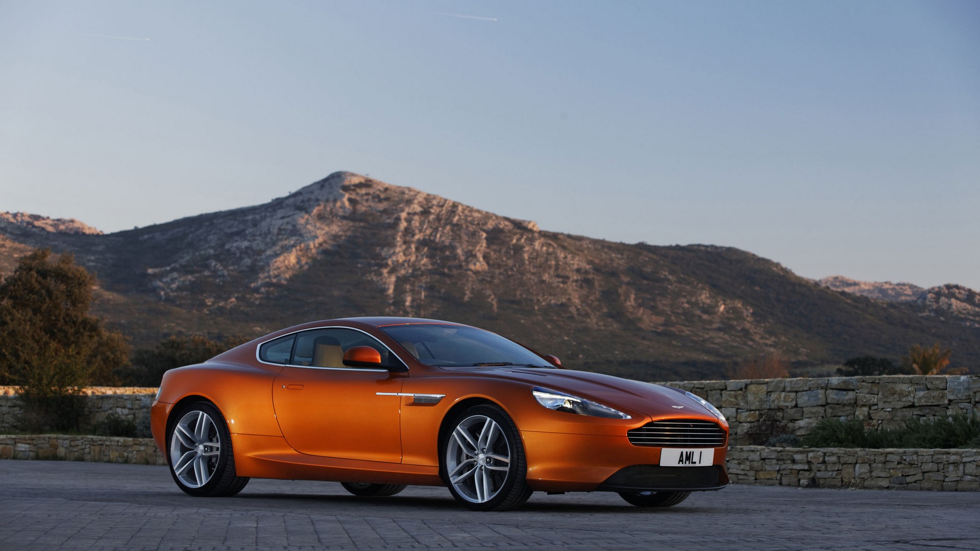 Orange Aston Martin Virage parked outdoors HD Wallpaper
