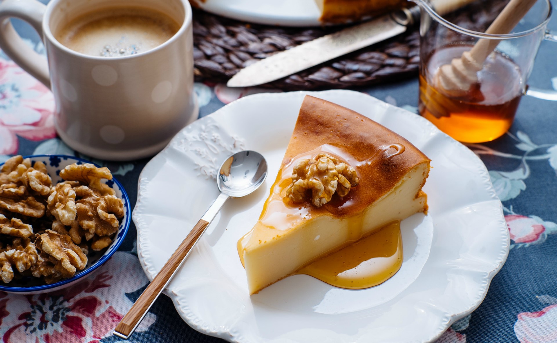 Slice of cheesecake with walnuts and honey, coffee, and nuts HD Wallpaper