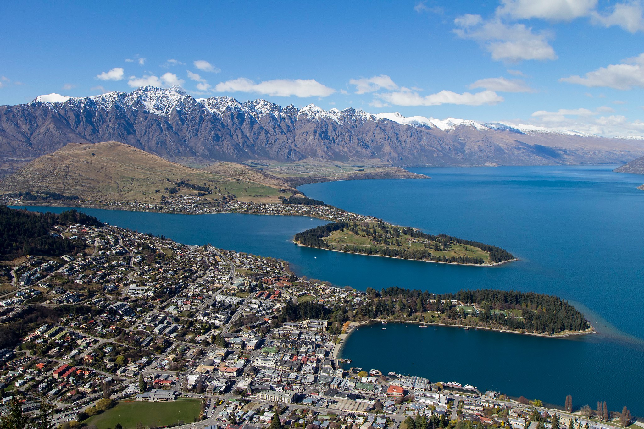 Aerial view of Queenstown and Lake Wakatipu with mountains HD Wallpaper
