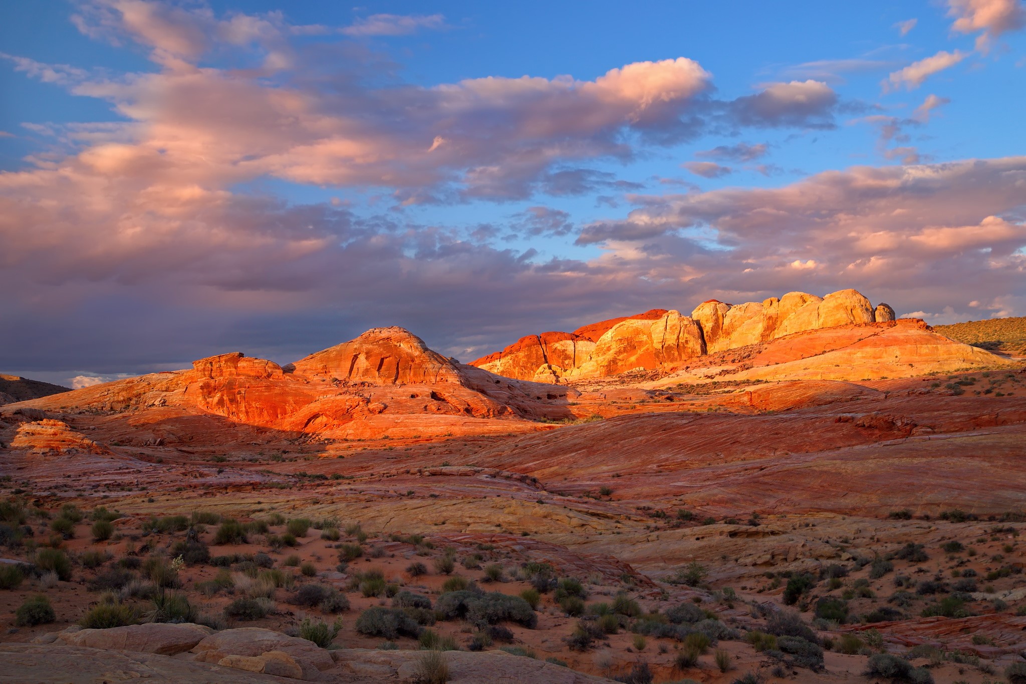 Desert mountains at sunset with colorful clouds HD Wallpaper