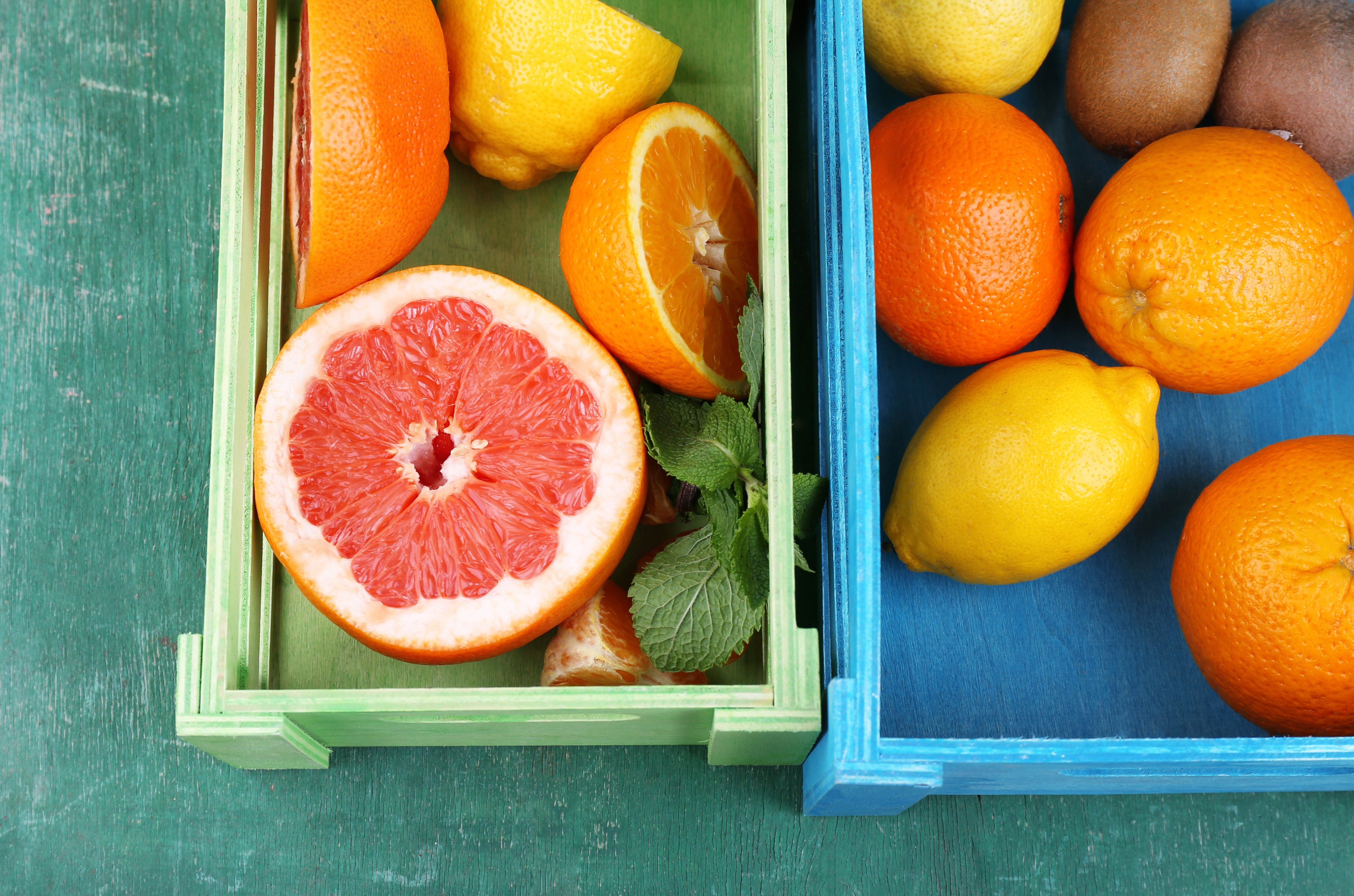 Citrus fruits in crates: oranges, lemons, grapefruit HD Wallpaper