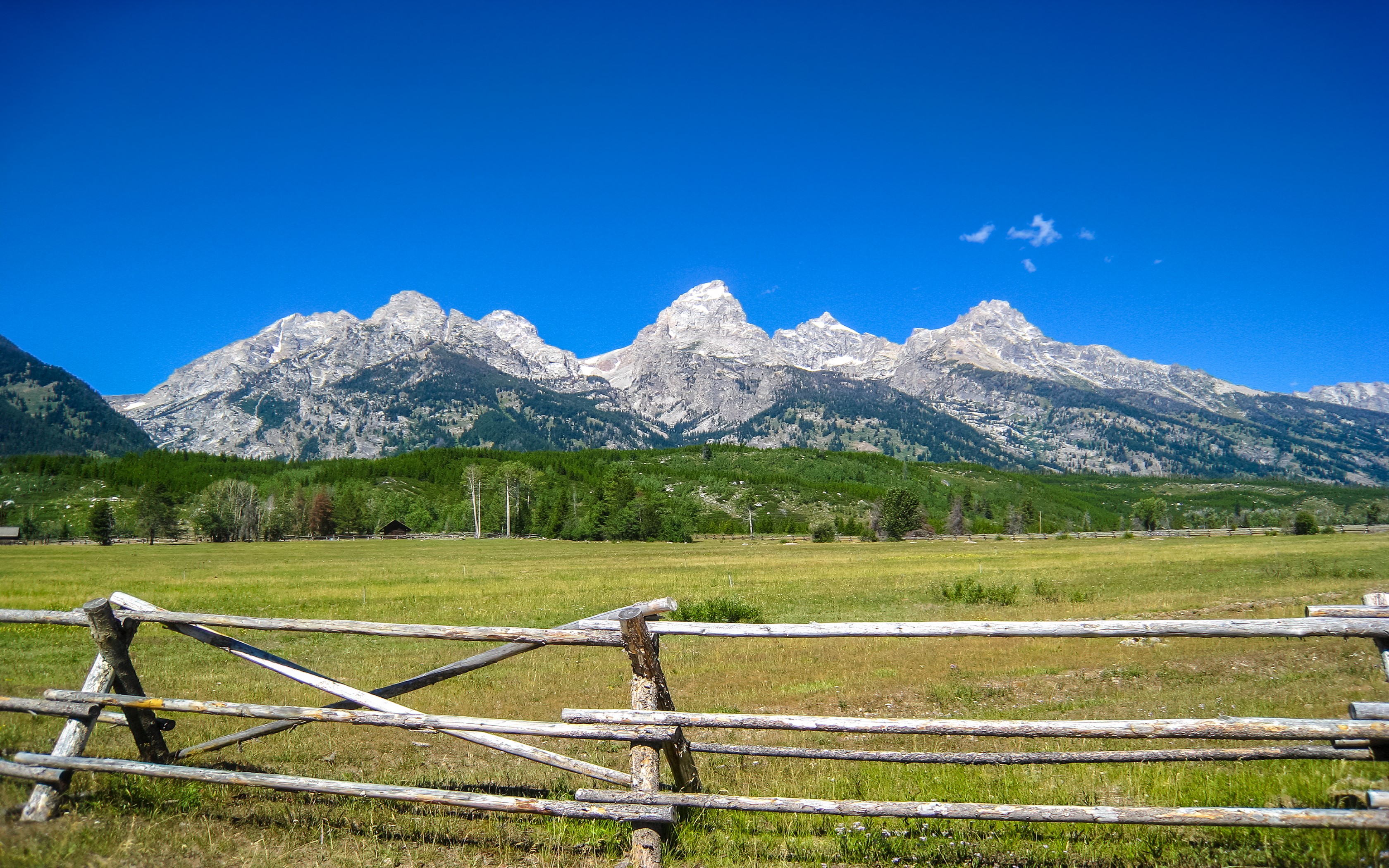 Grand Teton Mountains, Wyoming, USA, with a wooden fence HD Wallpaper