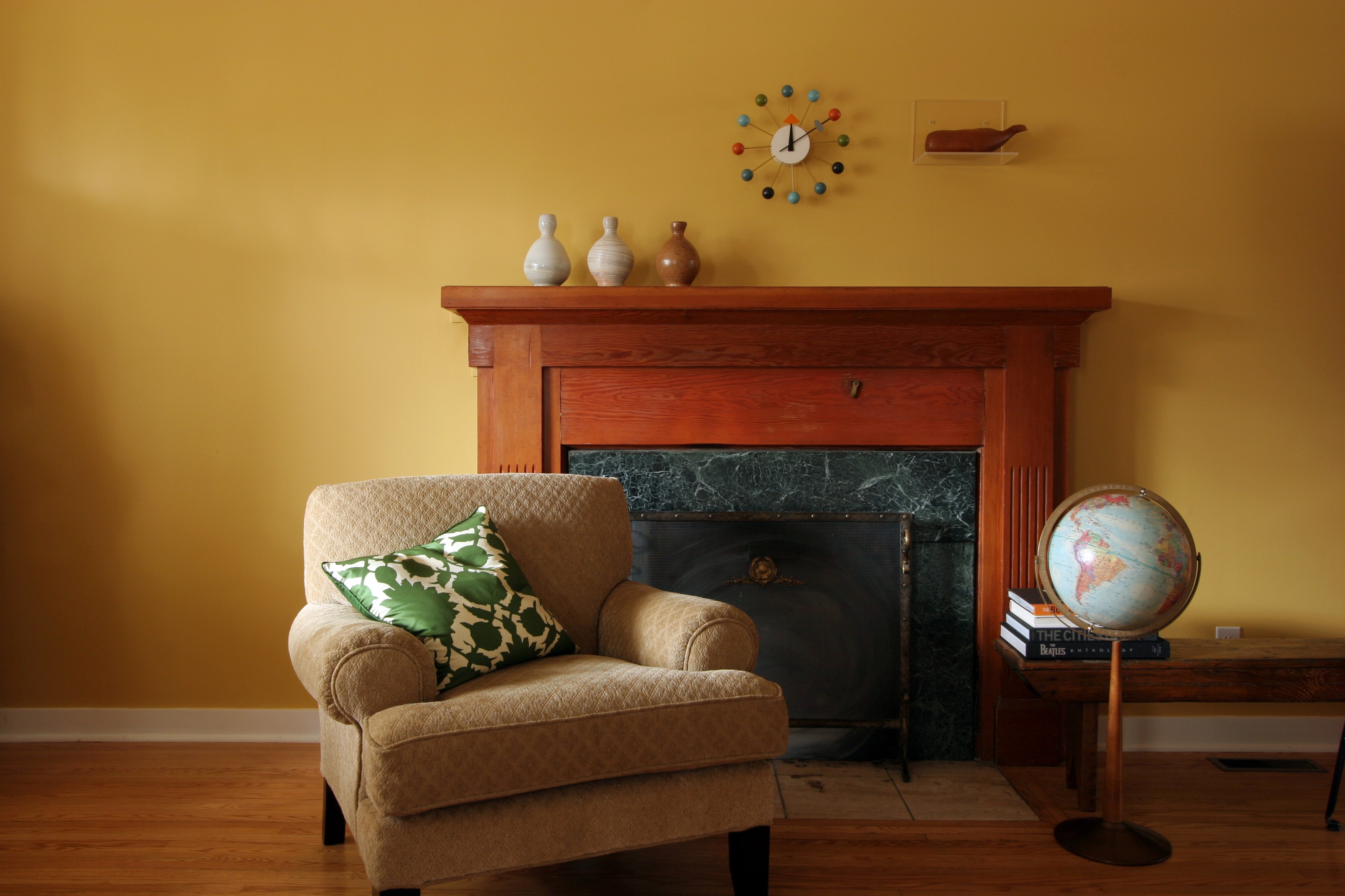 Living room with armchair and fireplace HD Wallpaper