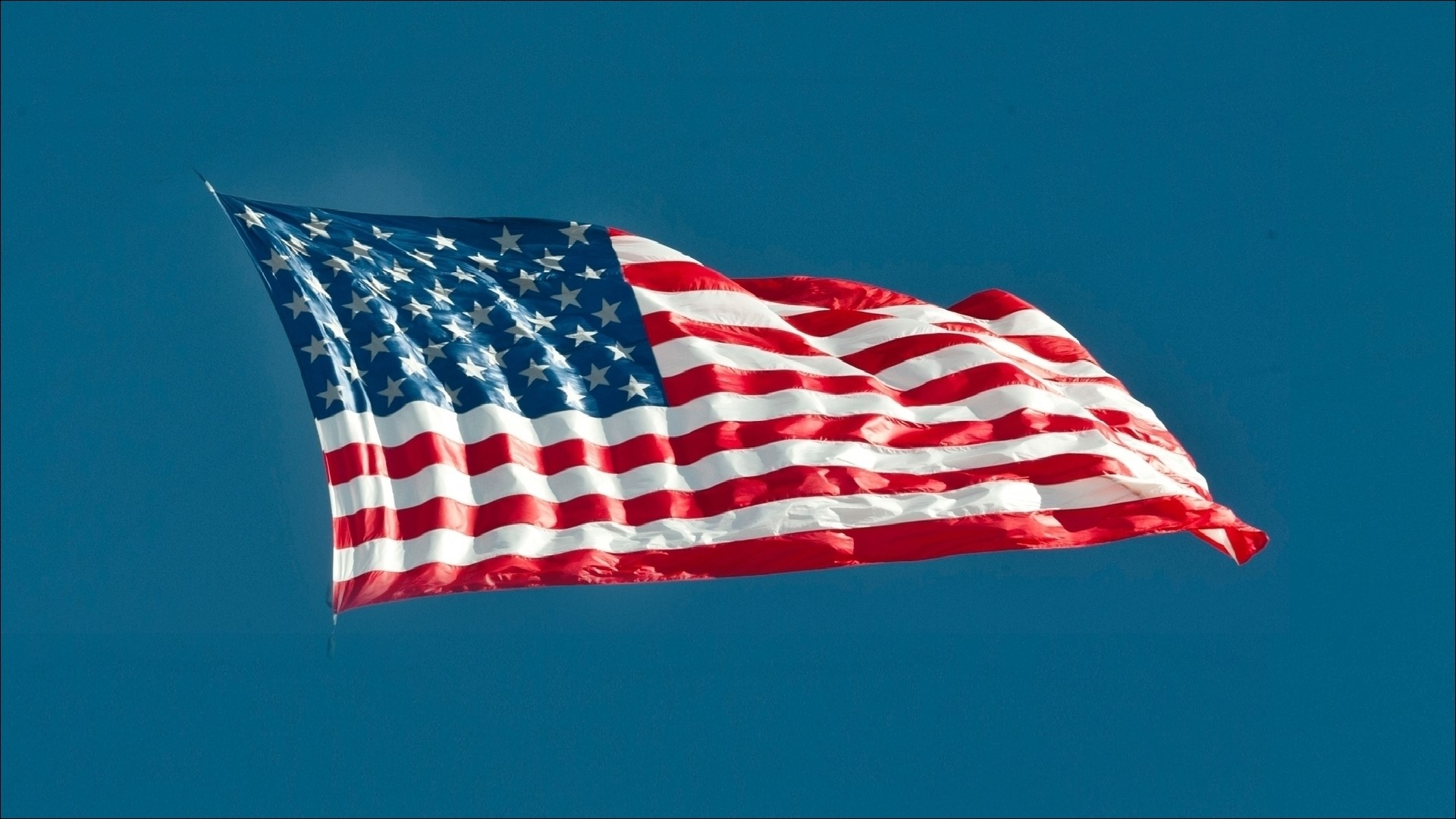American Flag Waving in Blue Sky HD Wallpaper