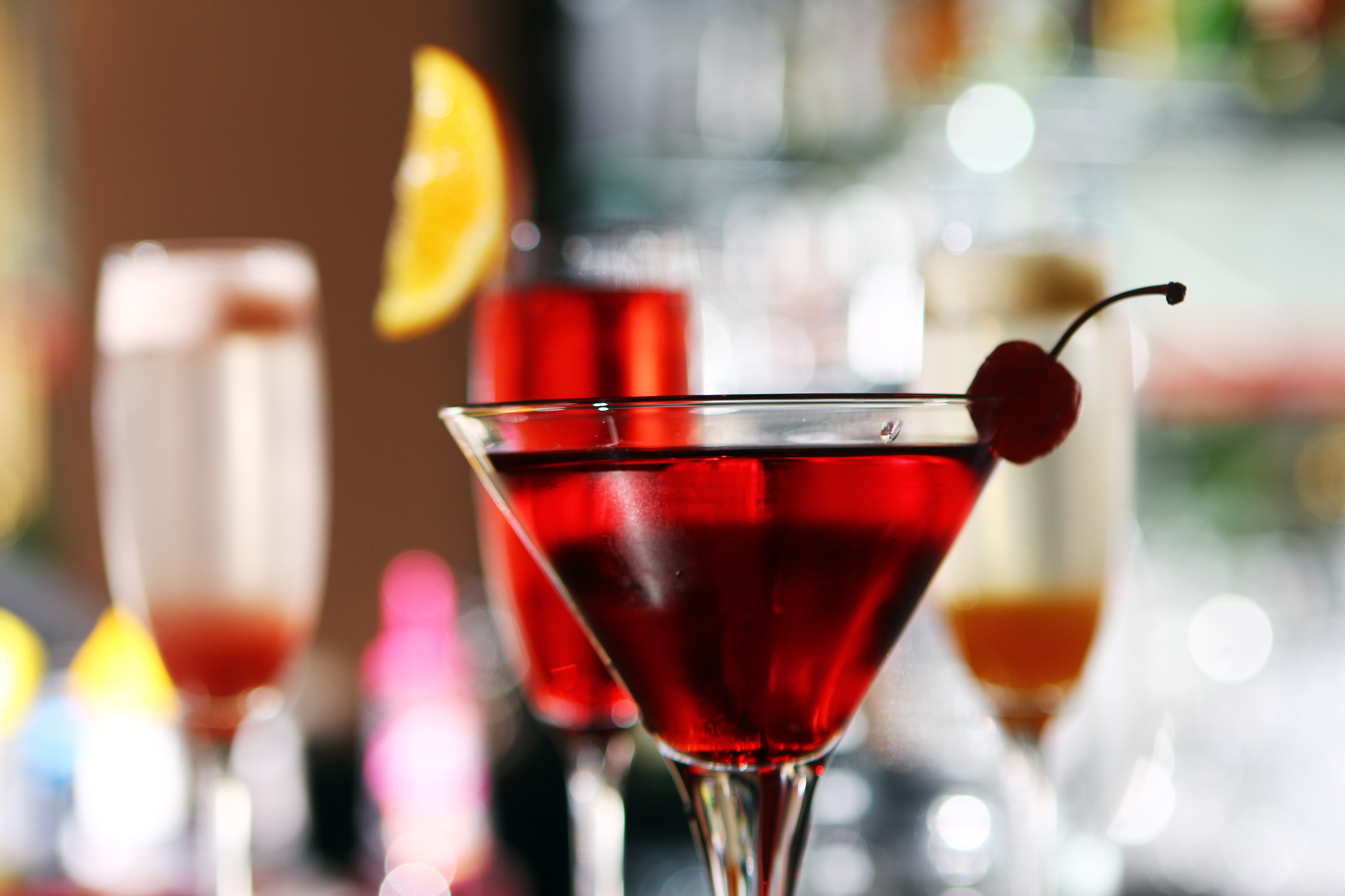 Cocktails with Cherry and Orange Garnish HD Wallpaper